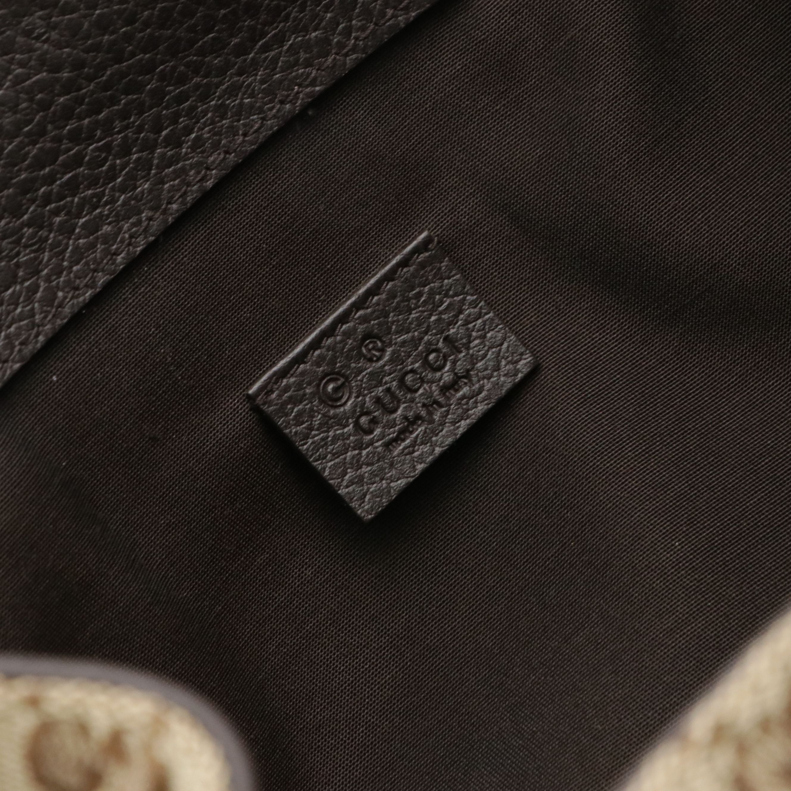 Gucci Side Zip Drawstring Backpack in Brown GG Canvas and Leather