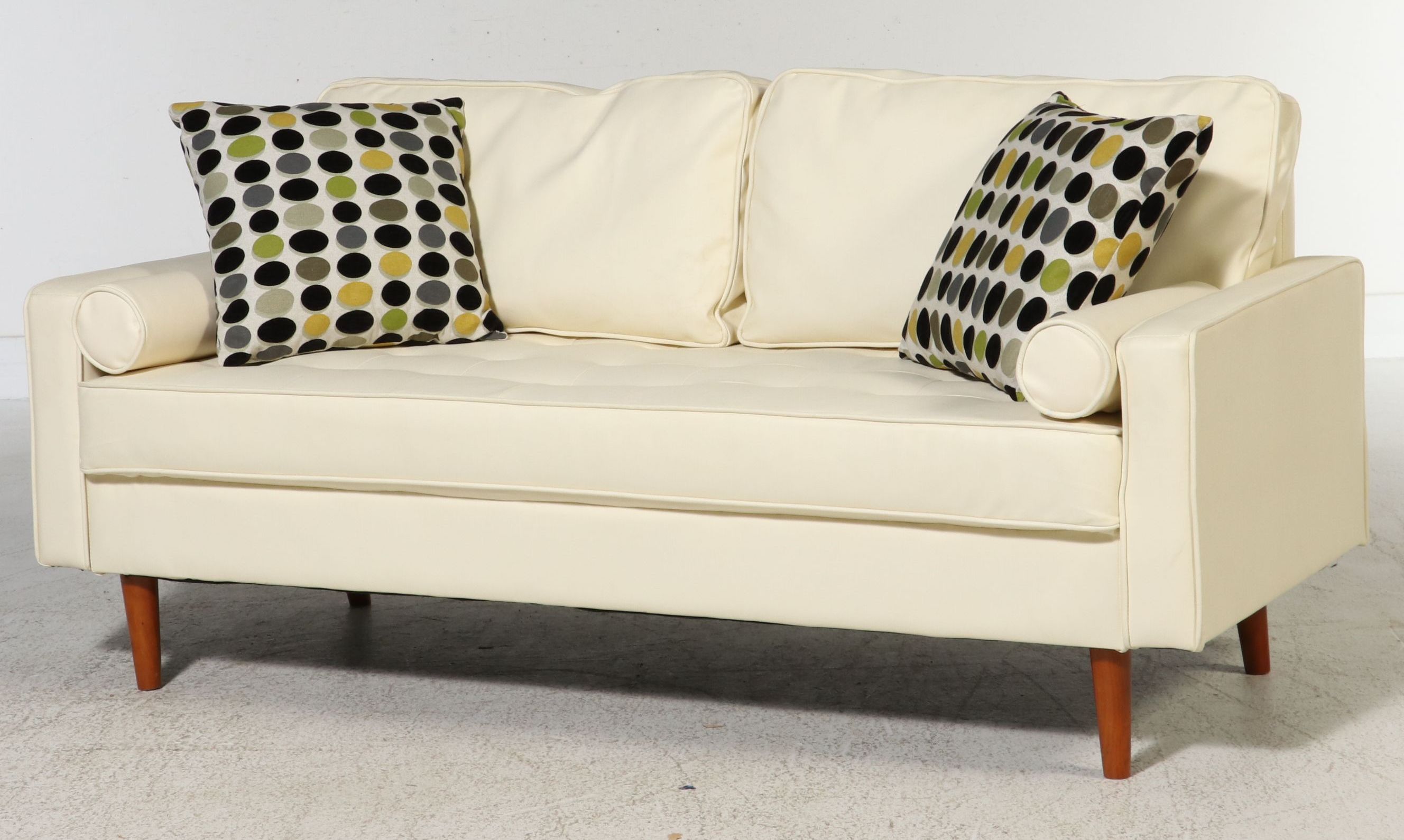 Contemporary Mid Century Modern Style Faux Leather Sofa and Polka Dot Pillows