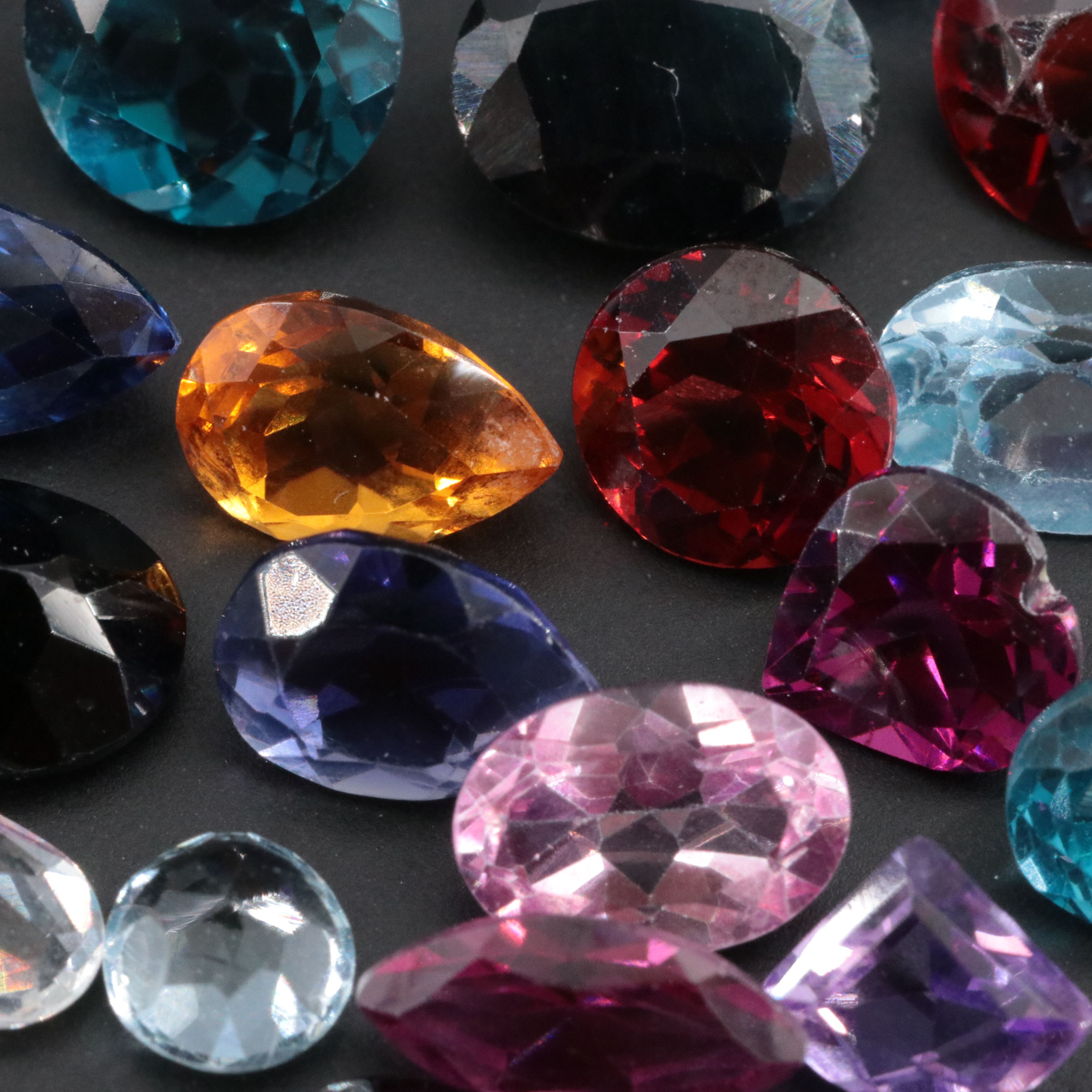 Loose 34.22 CTW Gemstone Lot Featuring Topaz, Citrine, Garnet