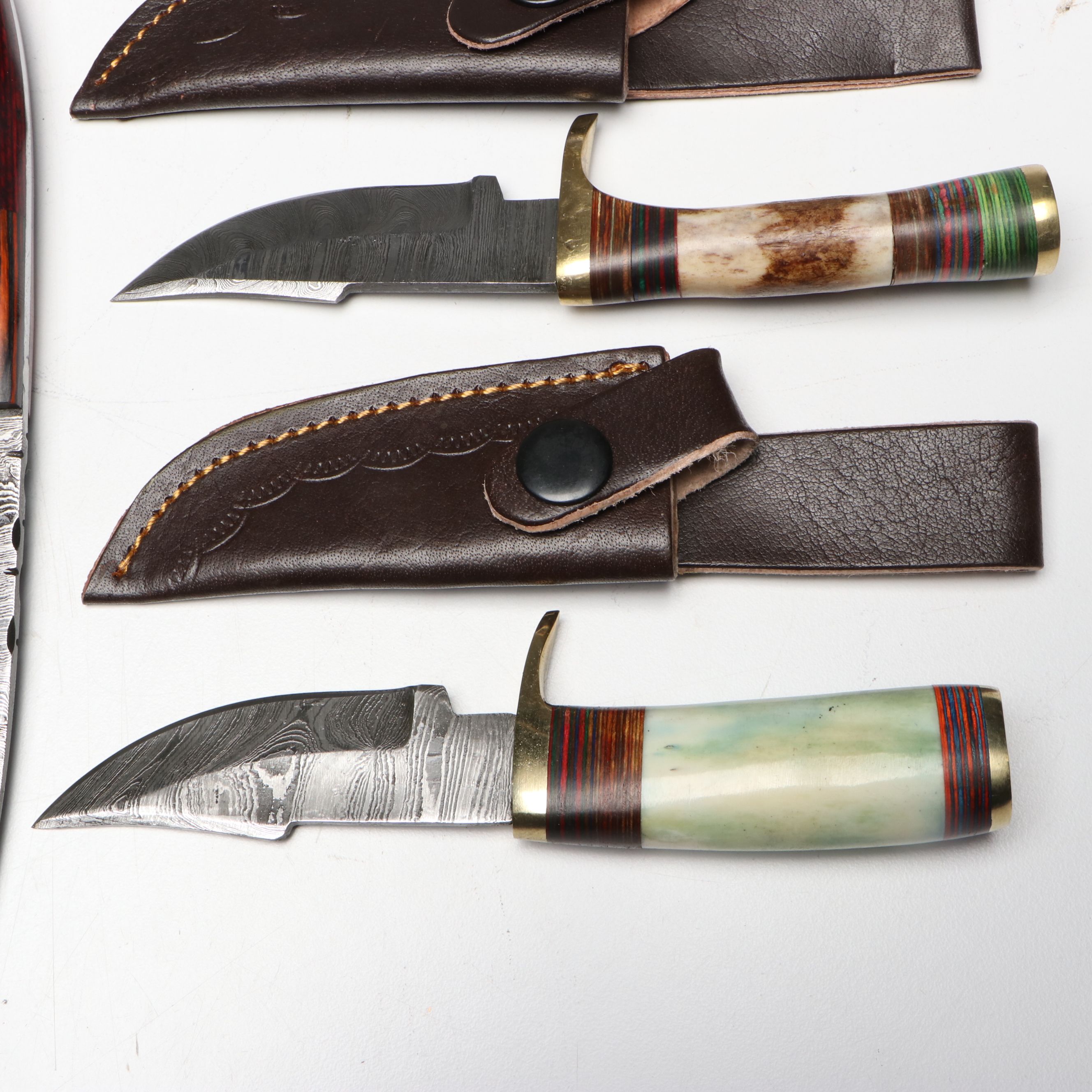 Damascus Steel Skinner and Hunting Knives in Leather Scabbards