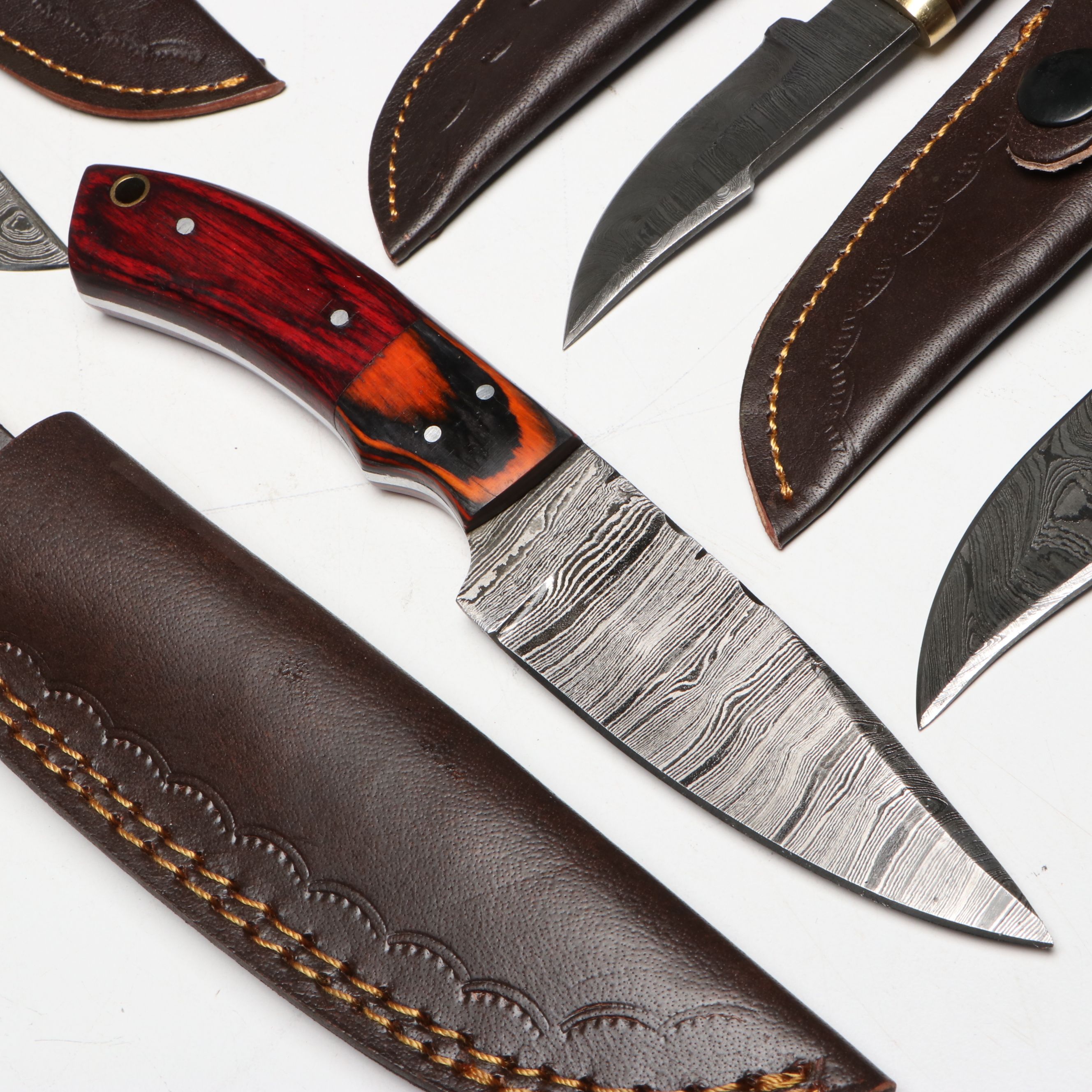 Damascus Steel Skinner and Hunting Knives in Leather Scabbards