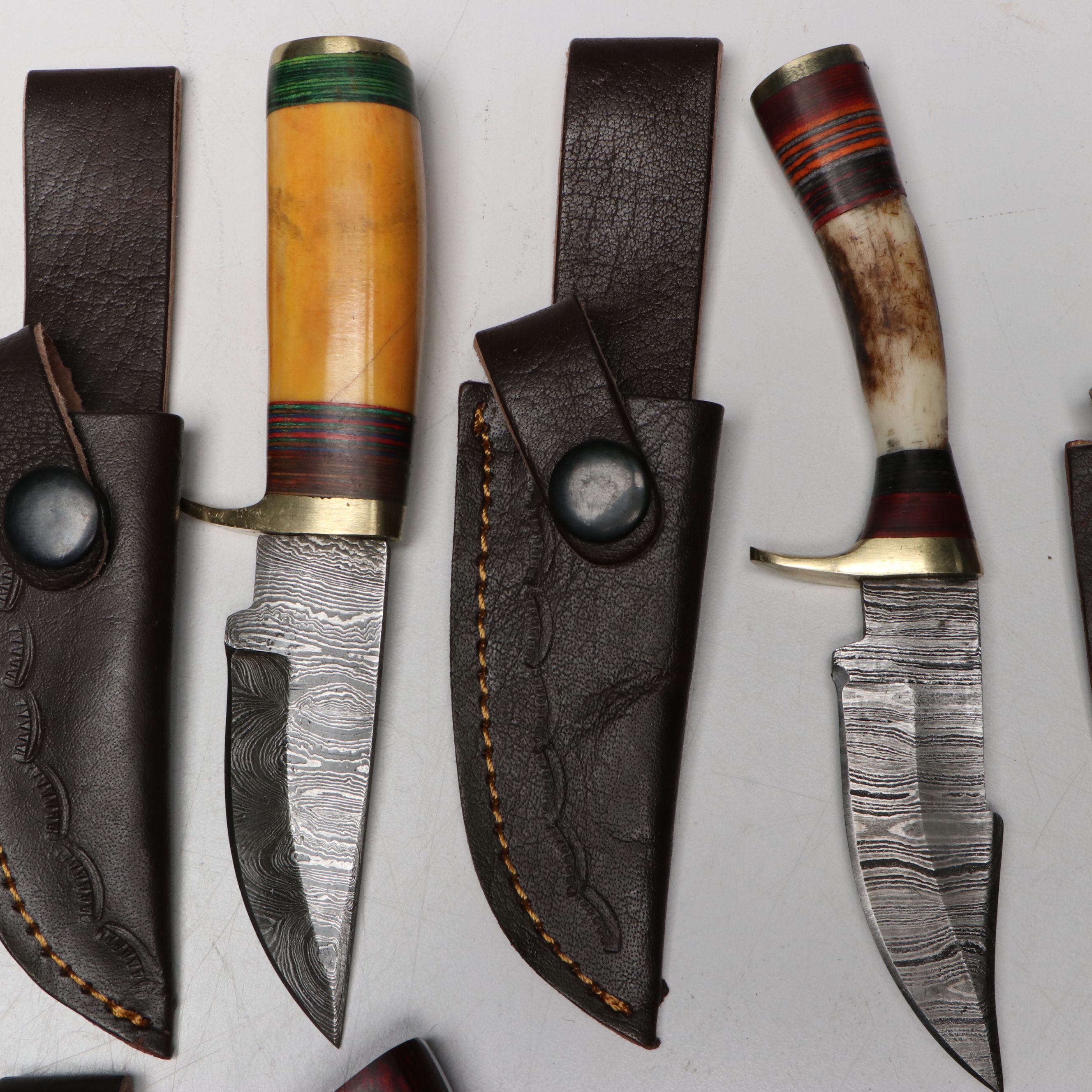 Damascus Steel Skinner and Hunting Knives in Leather Scabbards