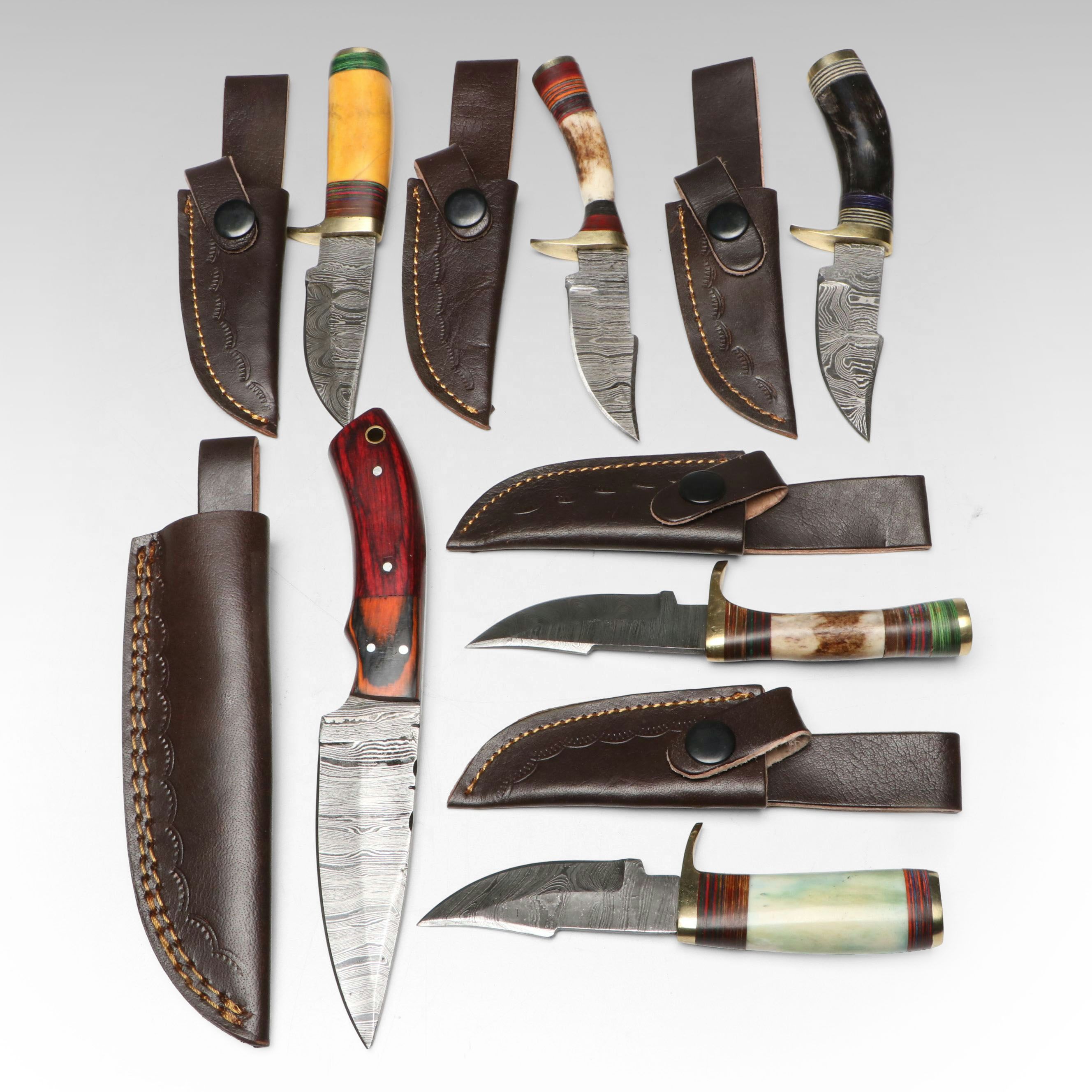 Damascus Steel Skinner and Hunting Knives in Leather Scabbards
