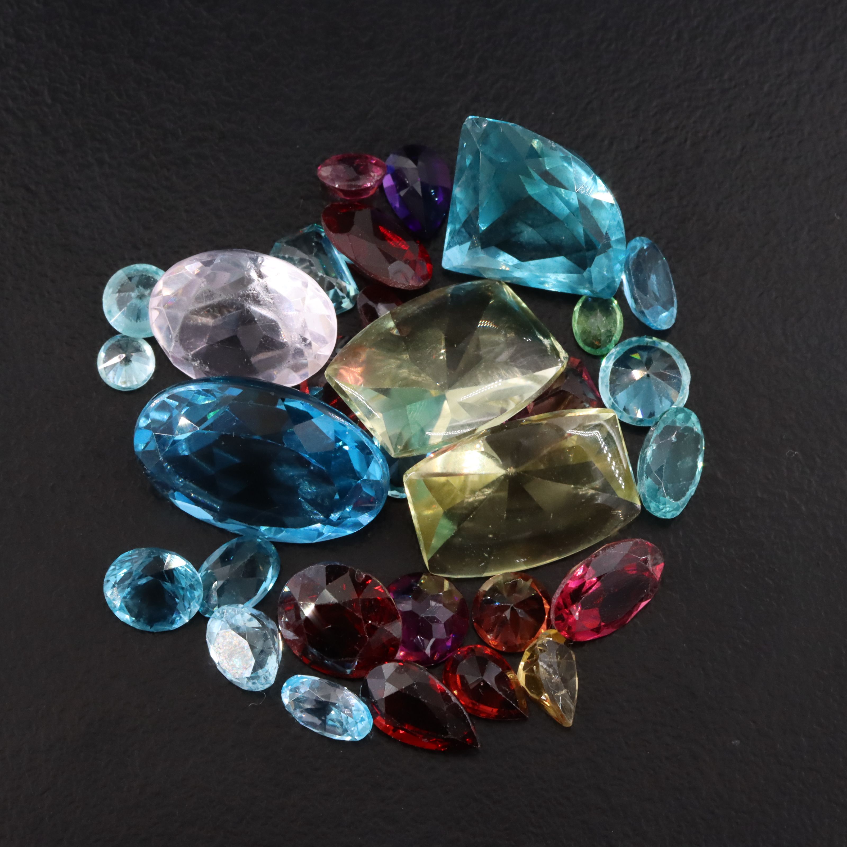Loose 52.78 CTW Gemstones Including Topaz, Garnet and Citrine