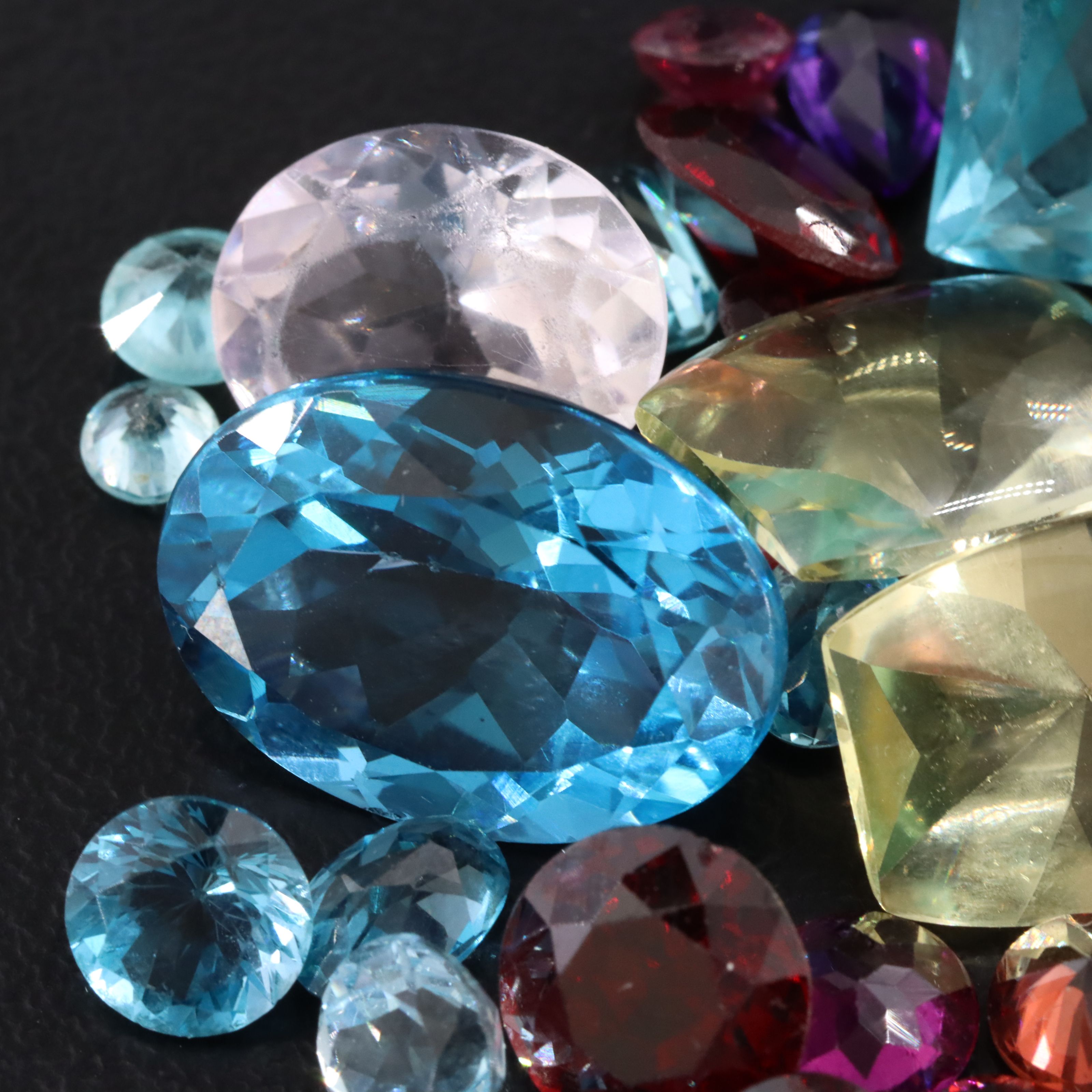 Loose 52.78 CTW Gemstones Including Topaz, Garnet and Citrine