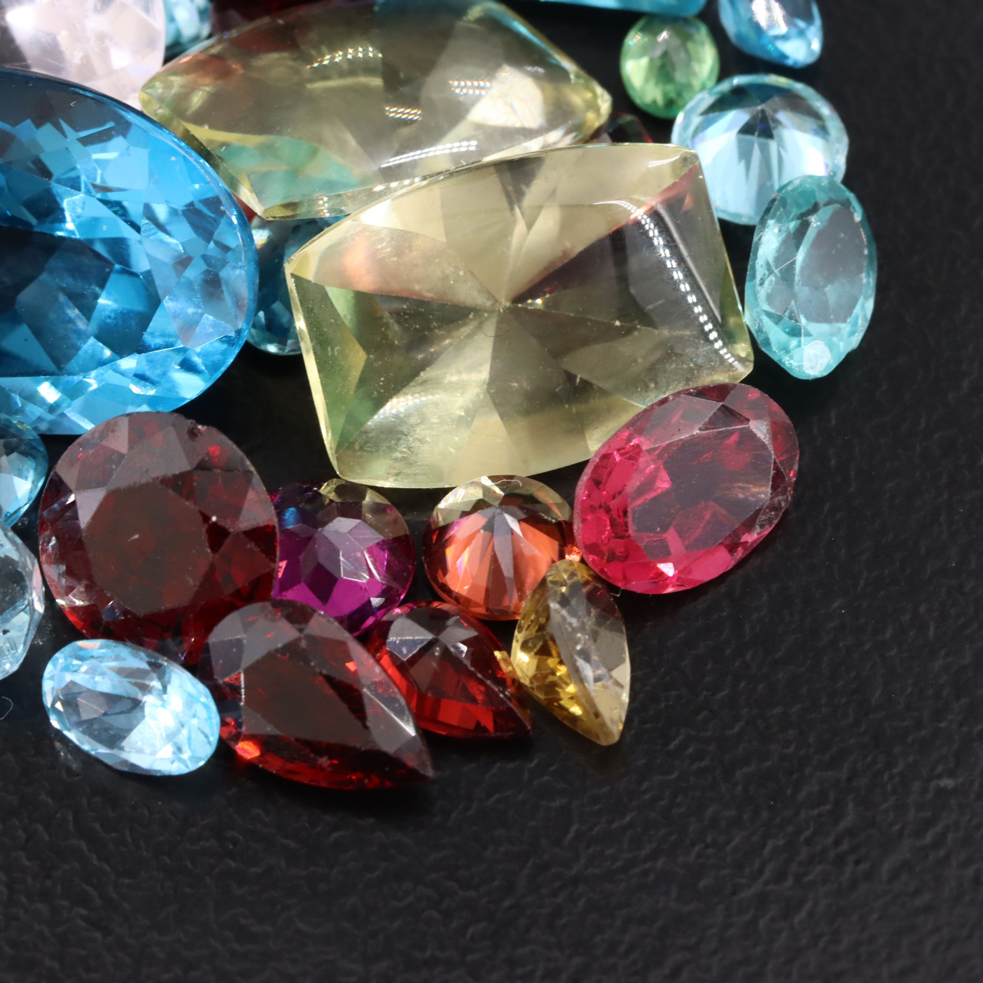 Loose 52.78 CTW Gemstones Including Topaz, Garnet and Citrine