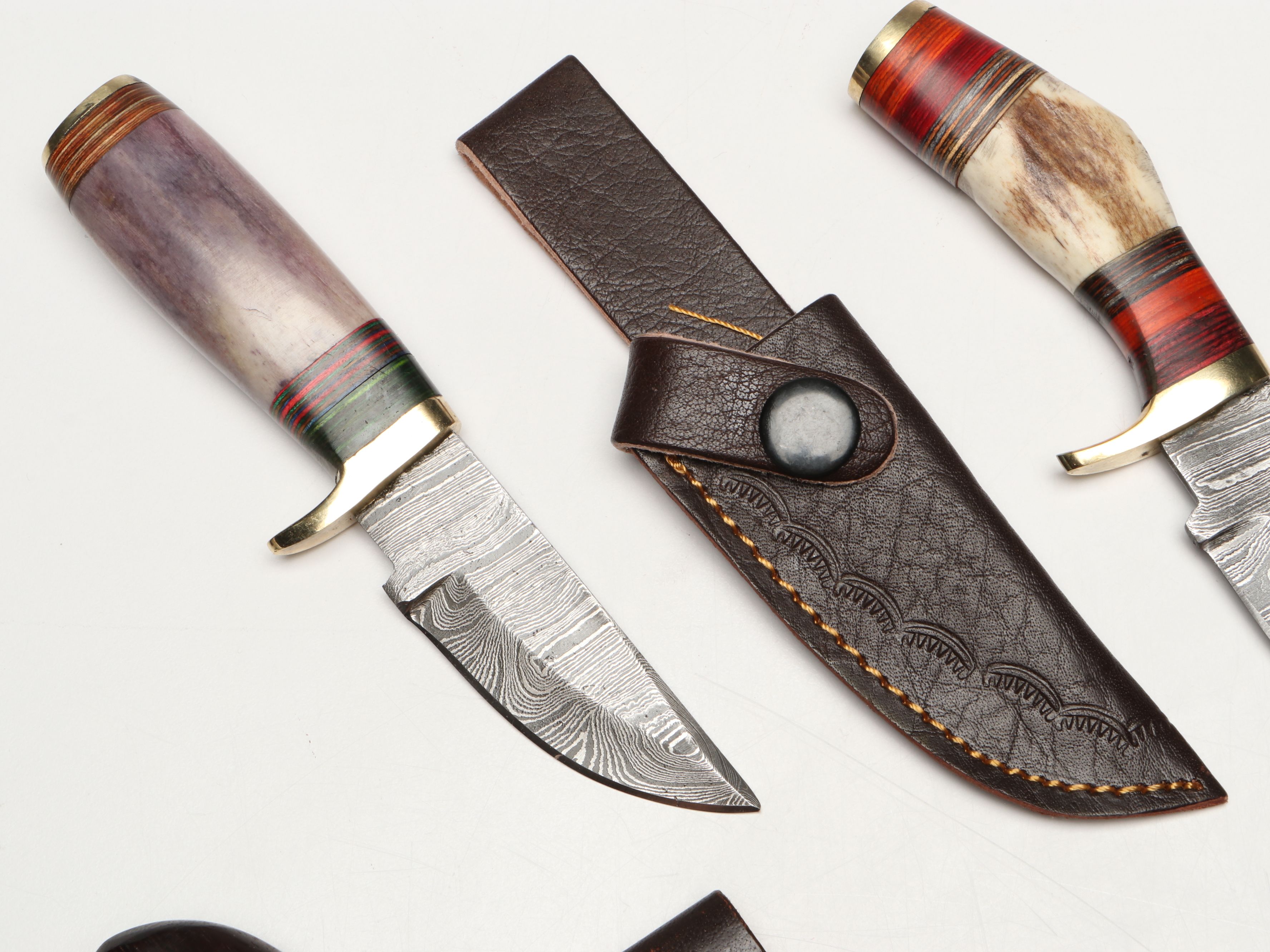 Damascus Steel Skinner and Hunting Knives in Leather Scabbards