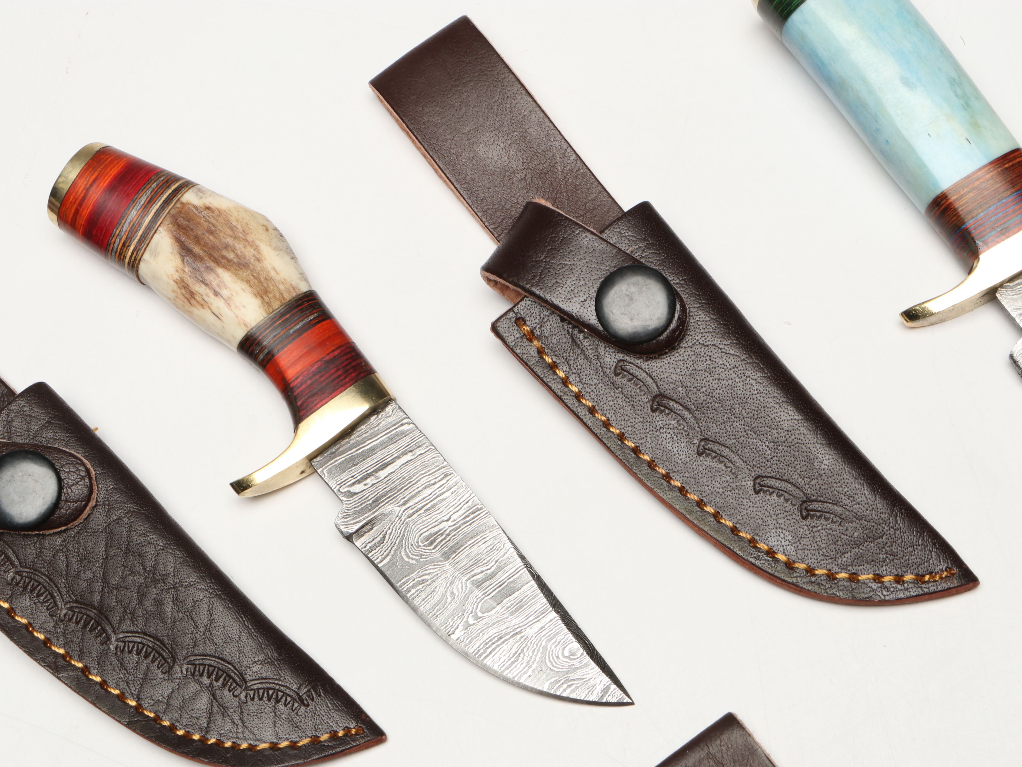 Damascus Steel Skinner and Hunting Knives in Leather Scabbards
