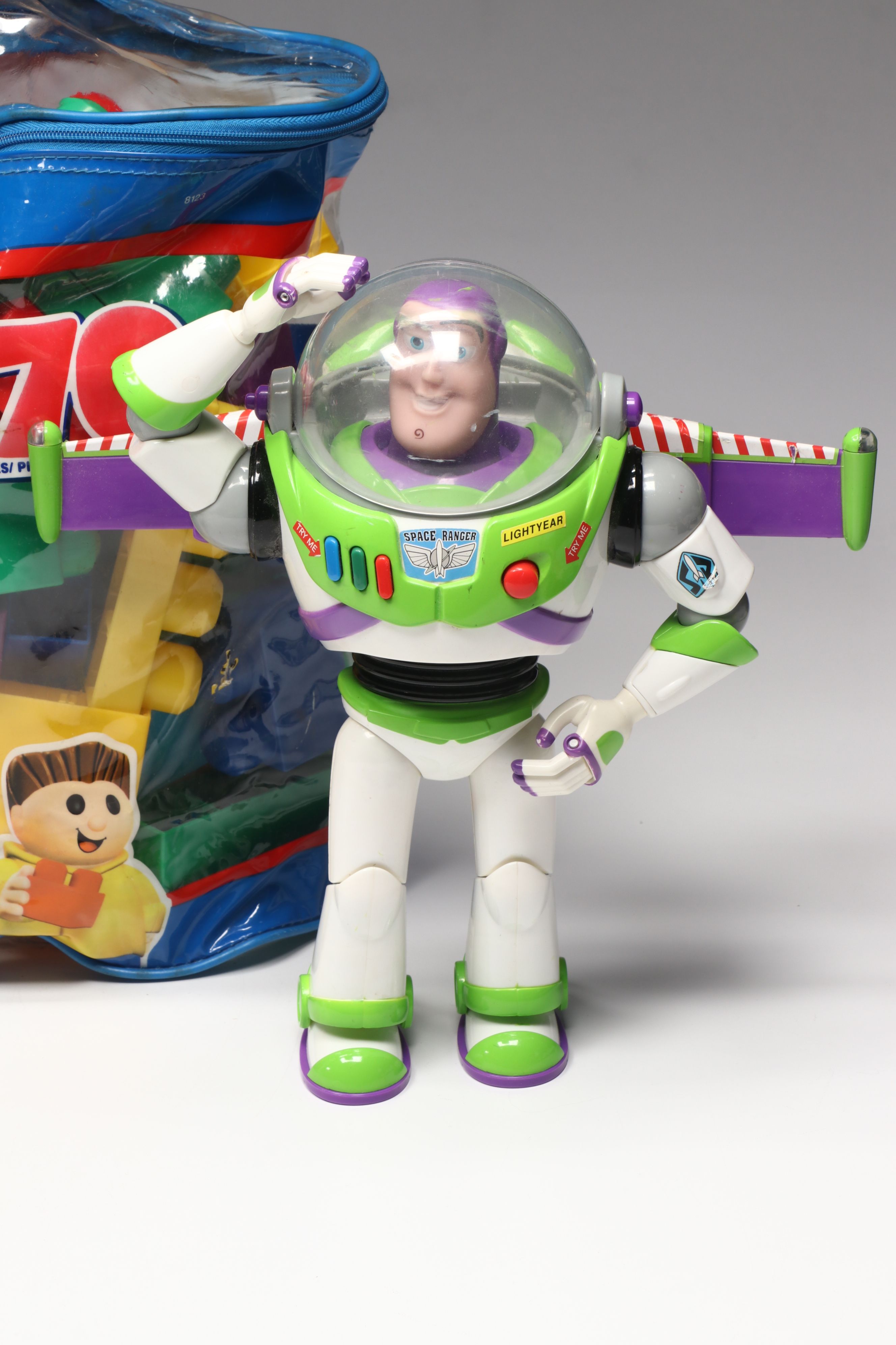 Plush Kermit the Frog, Buzz Lightyear Toys, and Mega Bloks Building Blocks