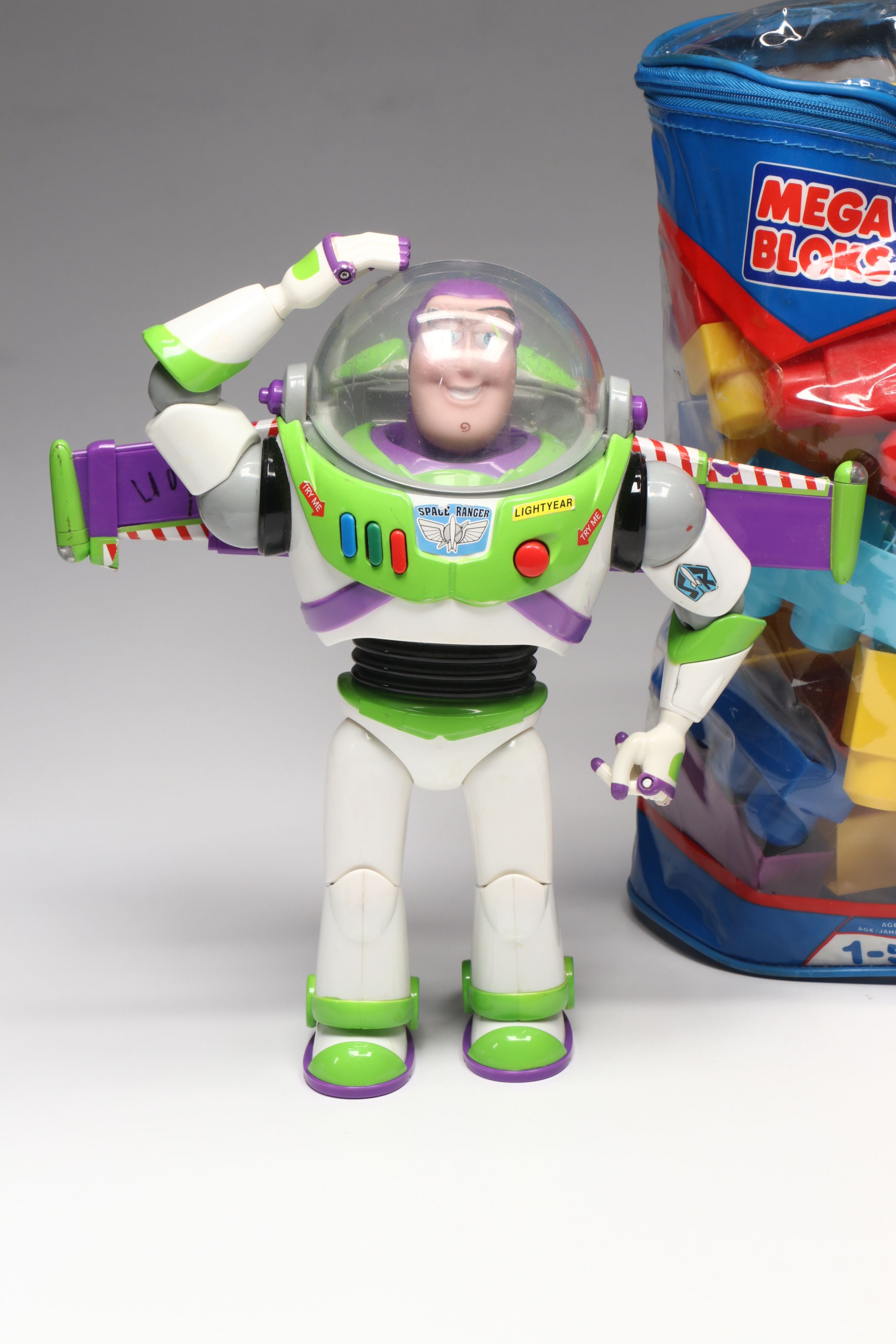Plush Kermit the Frog, Buzz Lightyear Toys, and Mega Bloks Building Blocks
