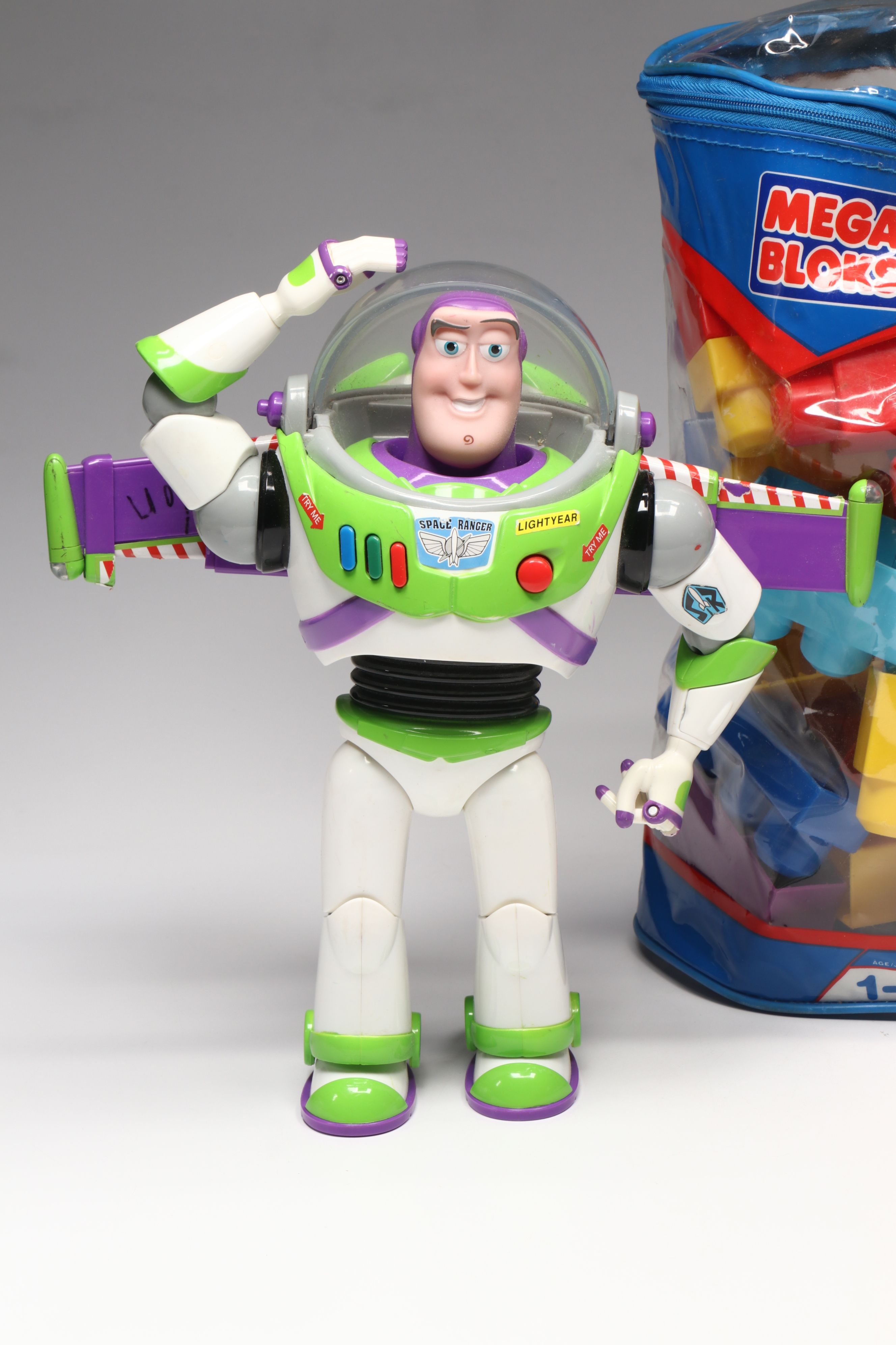 Plush Kermit the Frog, Buzz Lightyear Toys, and Mega Bloks Building Blocks