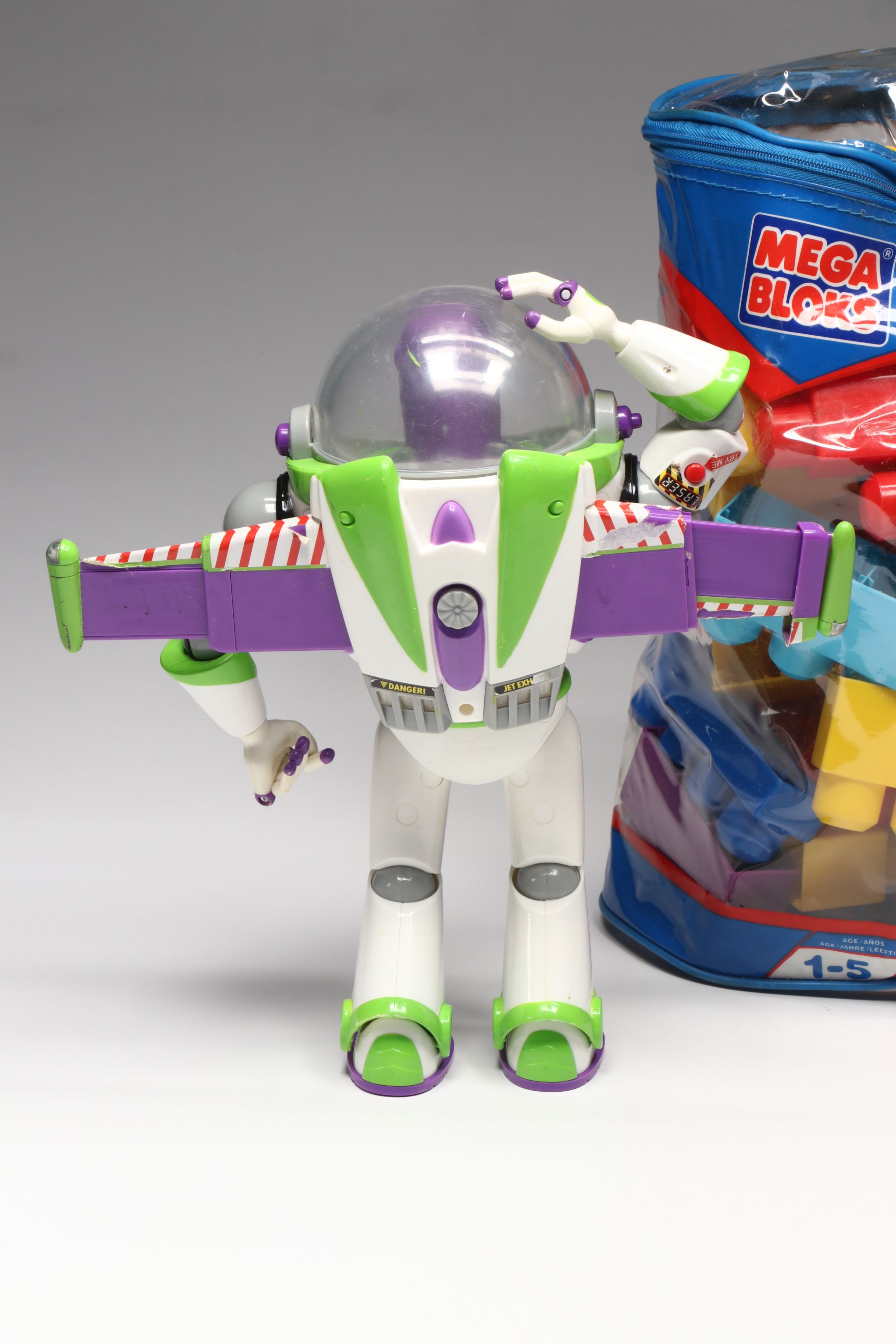 Plush Kermit the Frog, Buzz Lightyear Toys, and Mega Bloks Building Blocks