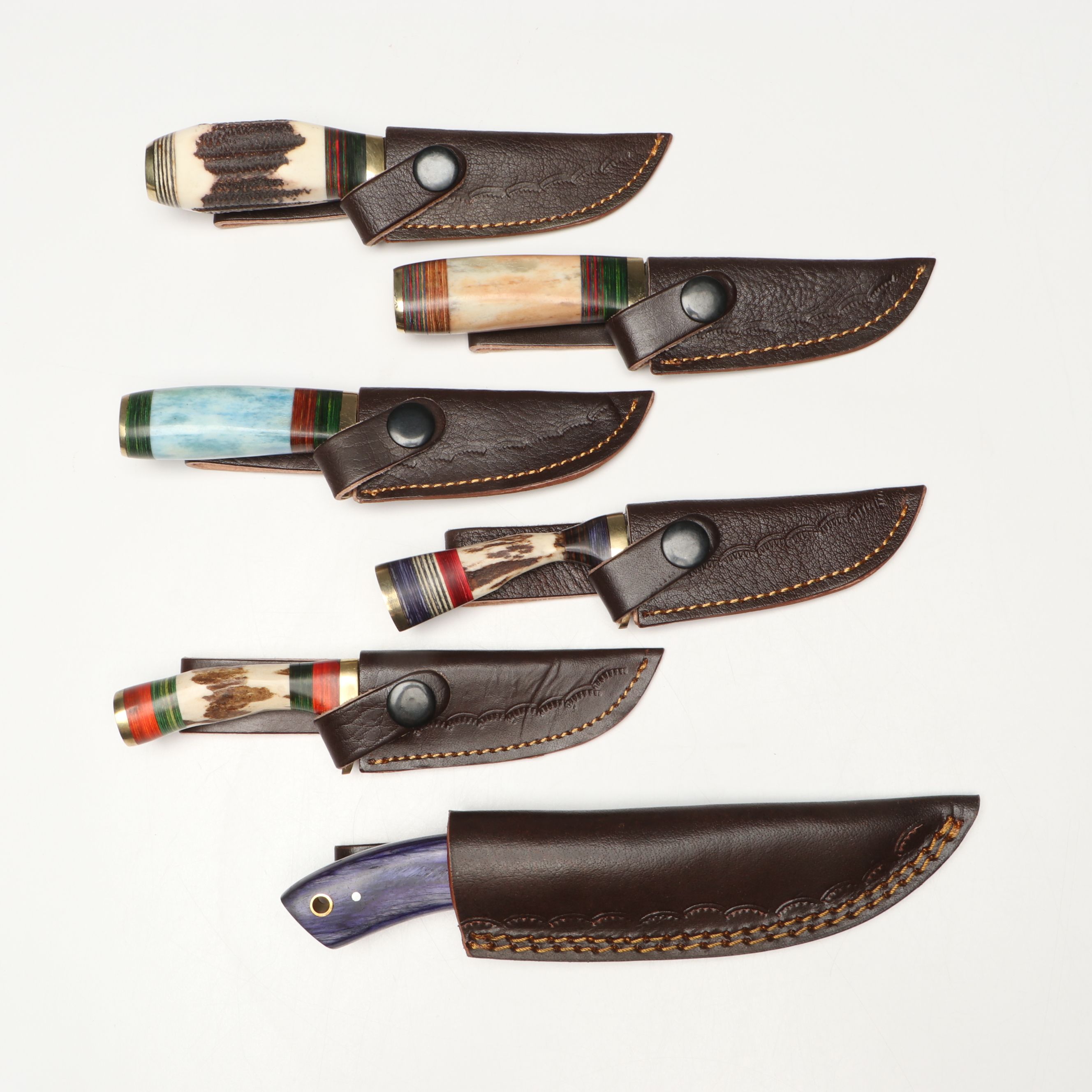 Damascus Steel Skinner and Hunting Knives in Leather Scabbards