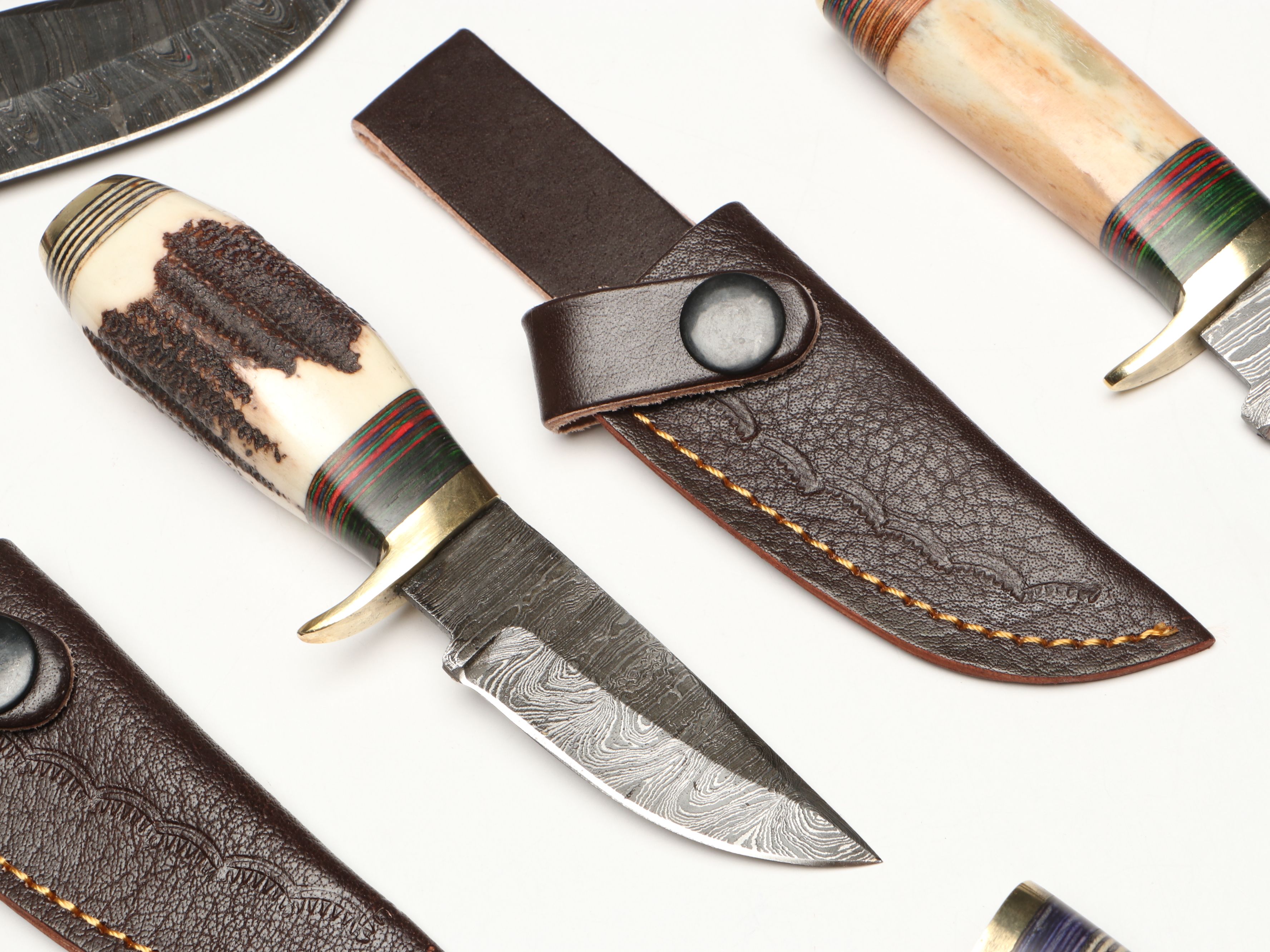Damascus Steel Skinner and Hunting Knives in Leather Scabbards