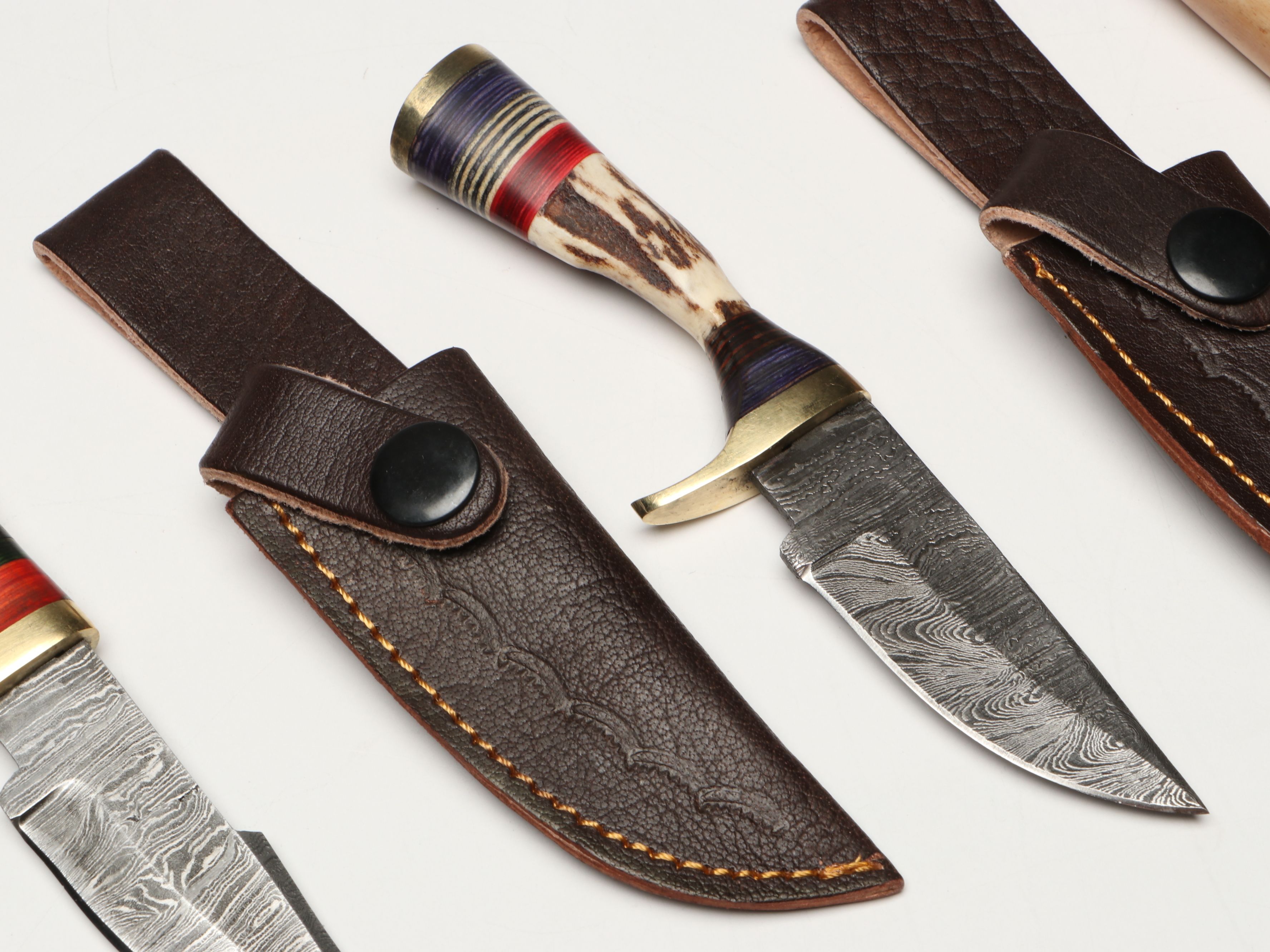 Damascus Steel Skinner and Hunting Knives in Leather Scabbards