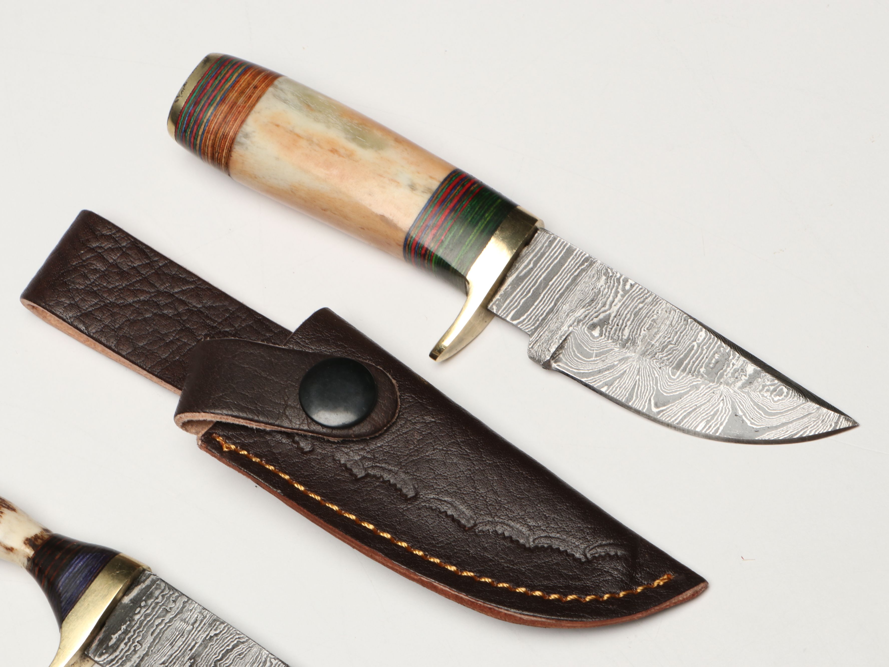 Damascus Steel Skinner and Hunting Knives in Leather Scabbards