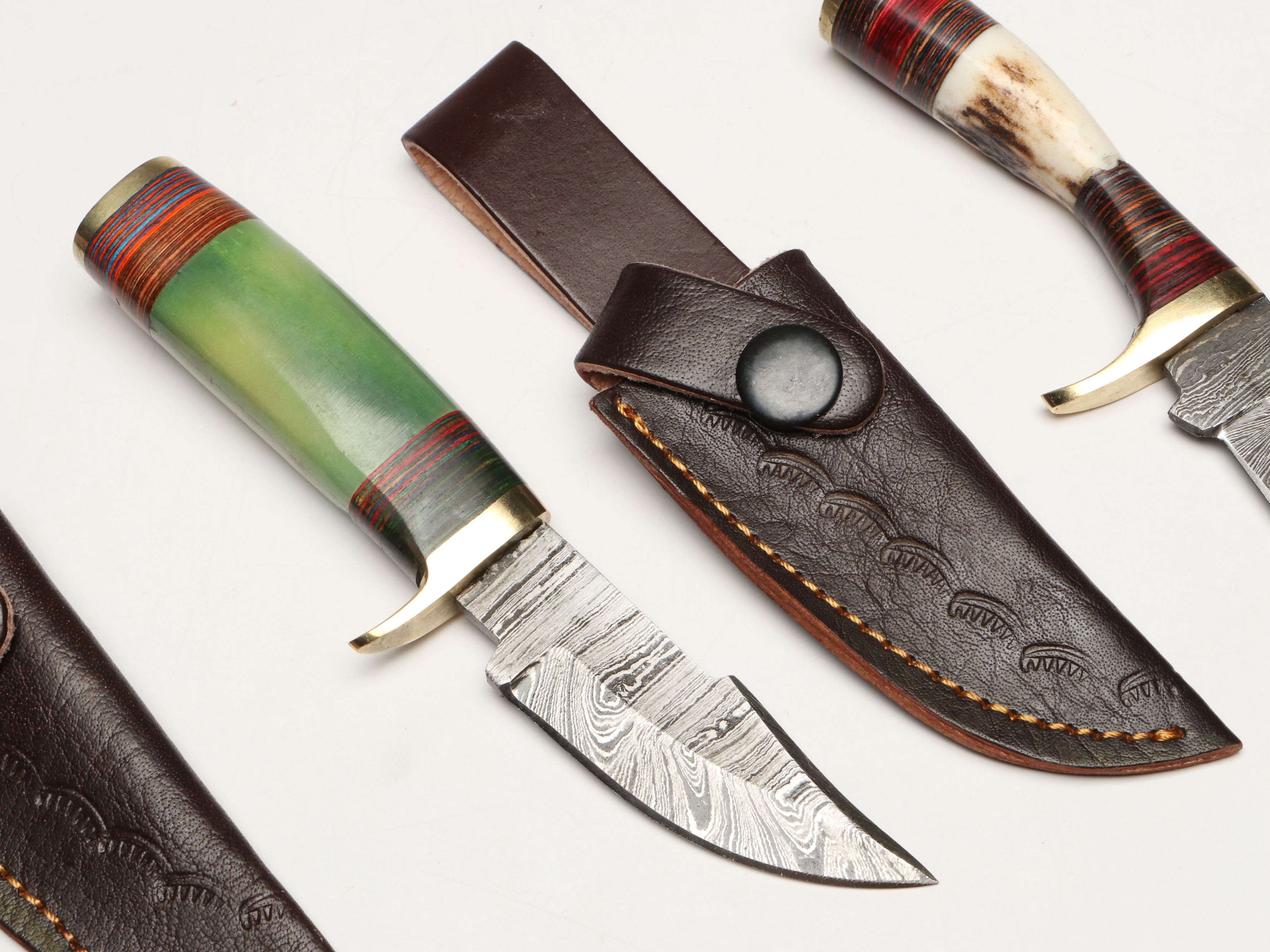 Damascus Steel Skinner and Hunting Knives in Leather Scabbards