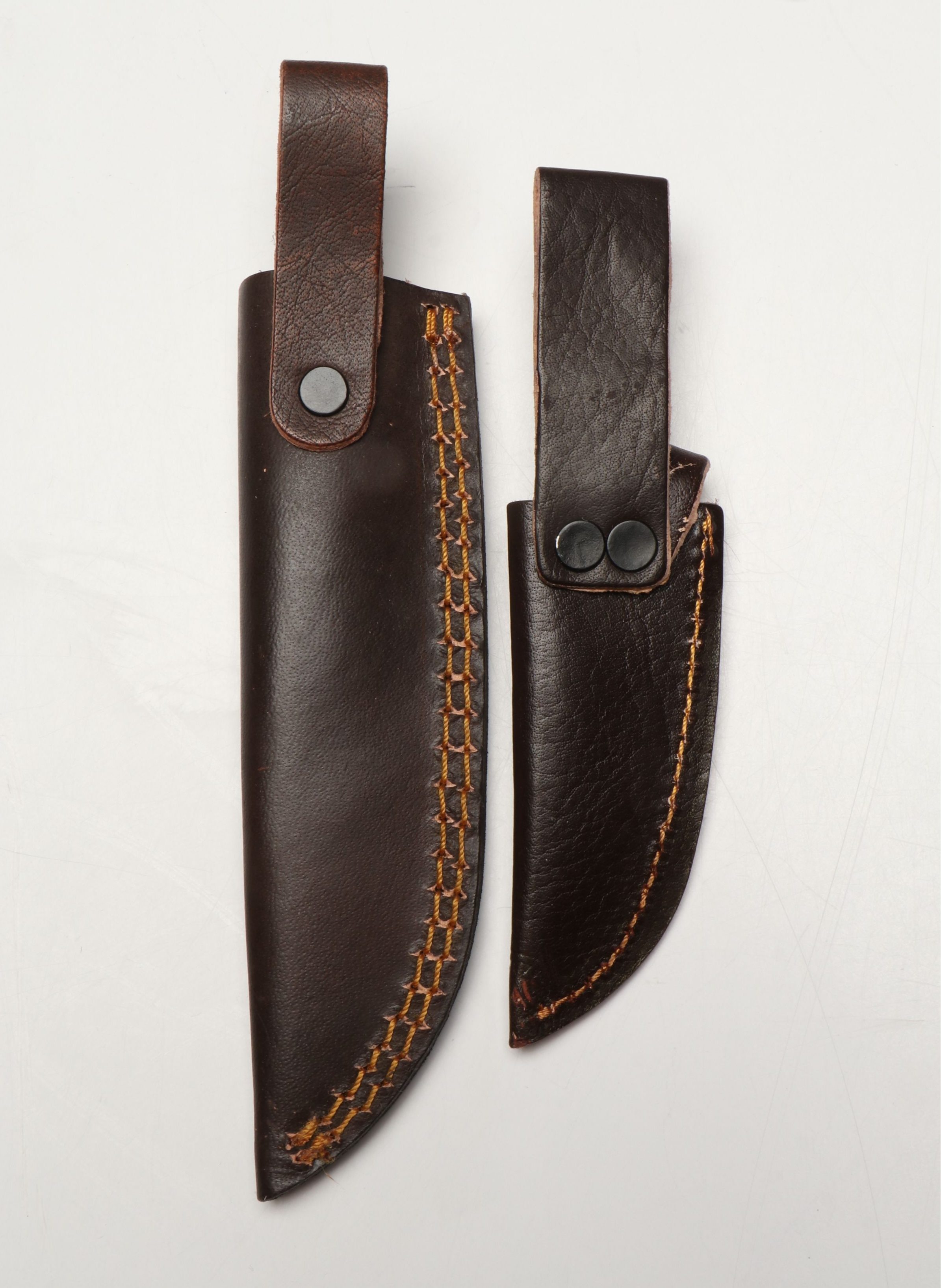 Damascus Steel Skinner and Hunting Knives in Leather Scabbards