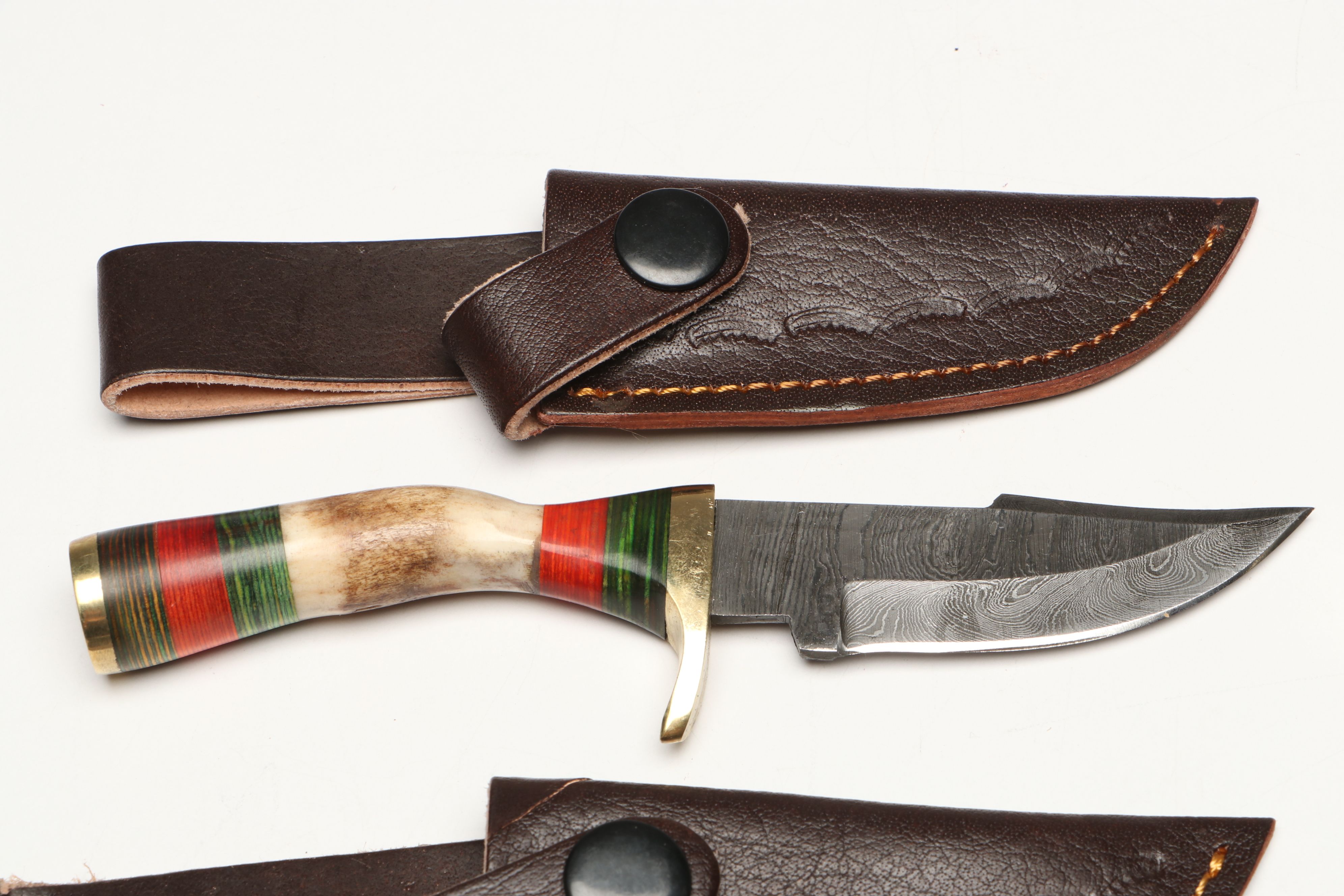 Damascus Steel Skinner and Hunting Knives in Leather Scabbards