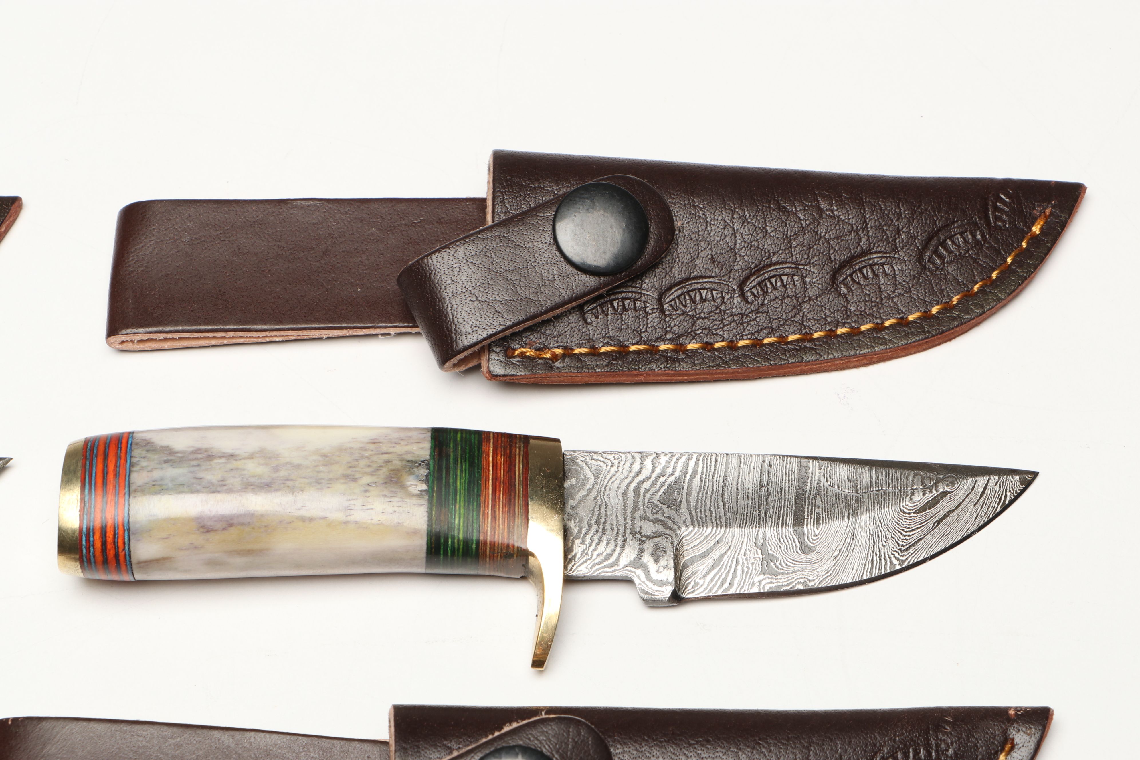Damascus Steel Skinner and Hunting Knives in Leather Scabbards