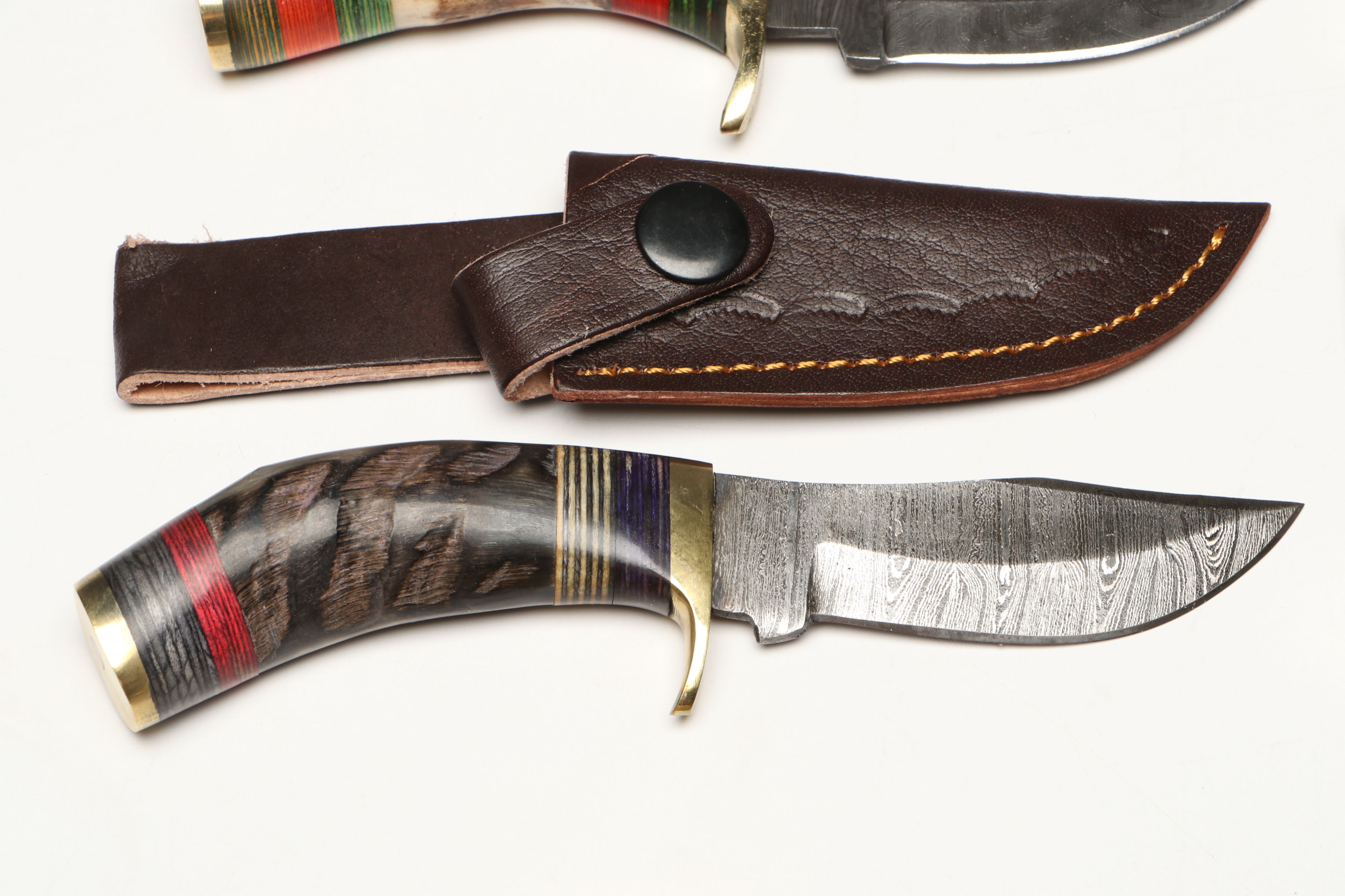 Damascus Steel Skinner and Hunting Knives in Leather Scabbards