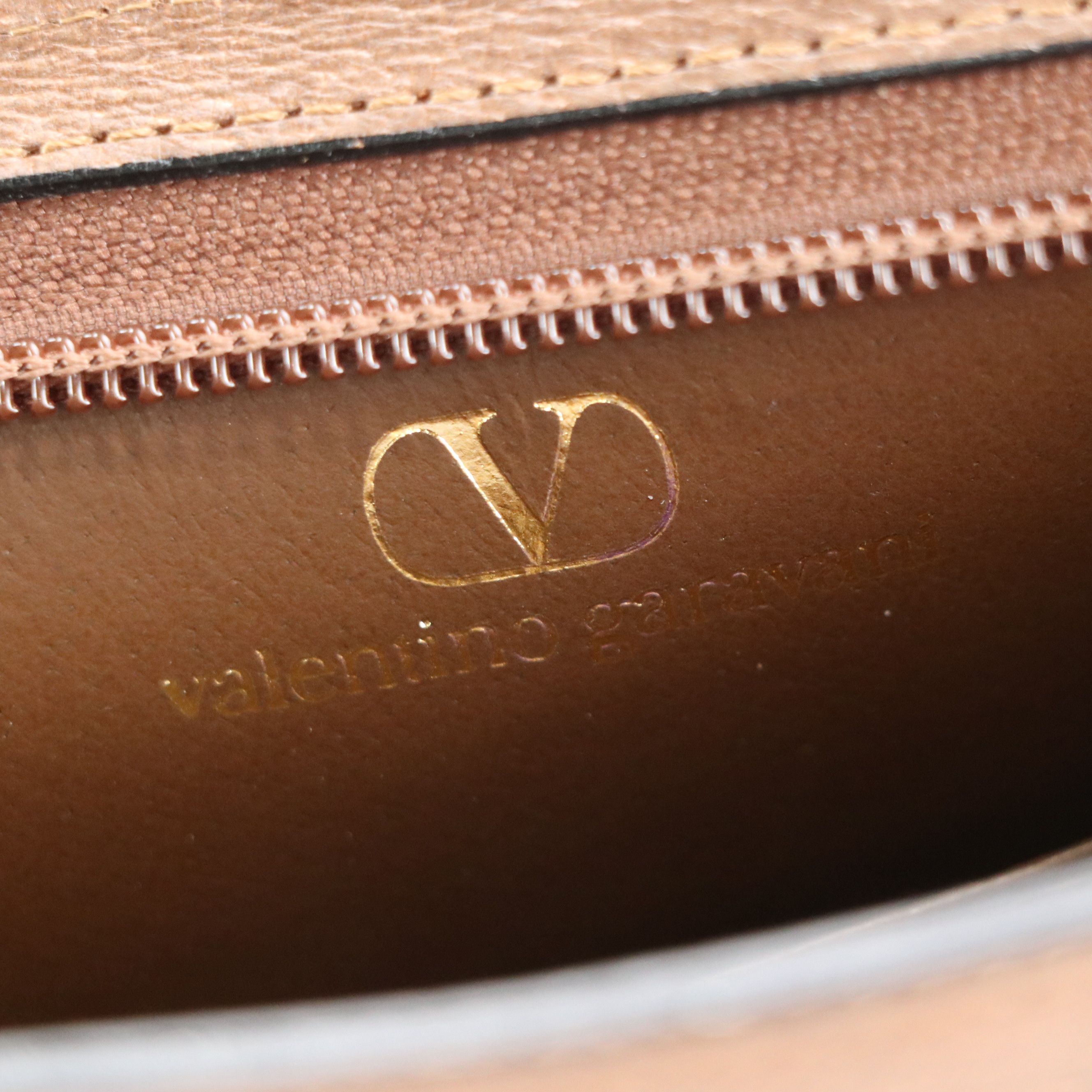 Valentino Garavani Zip Clutch in Brown Grained Leather