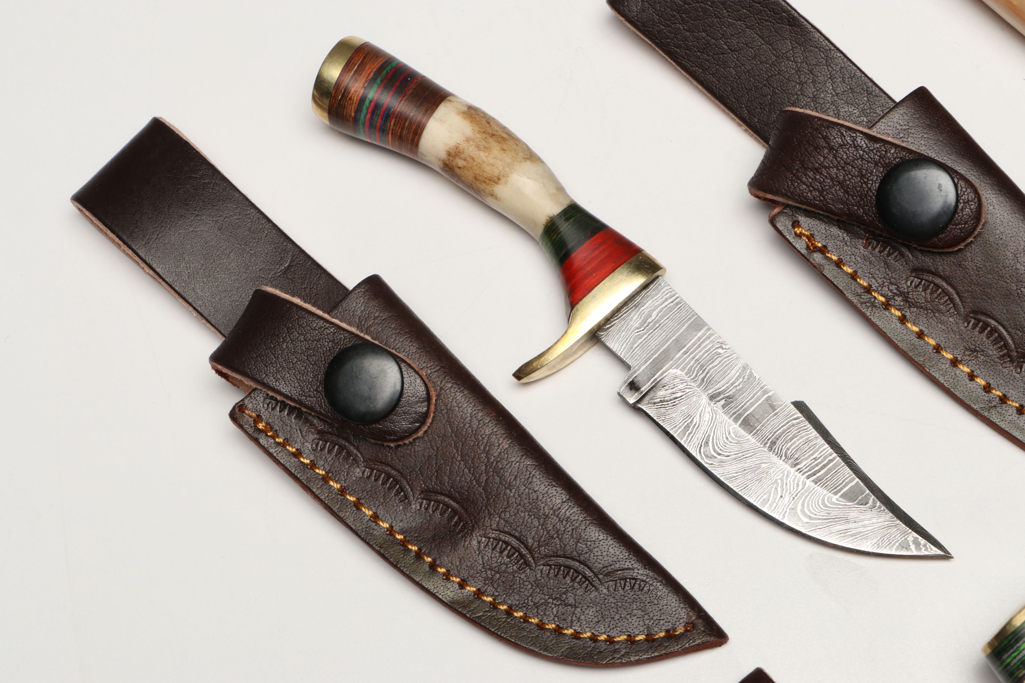 Damascus Steel Skinner and Hunting Knives in Leather Scabbards