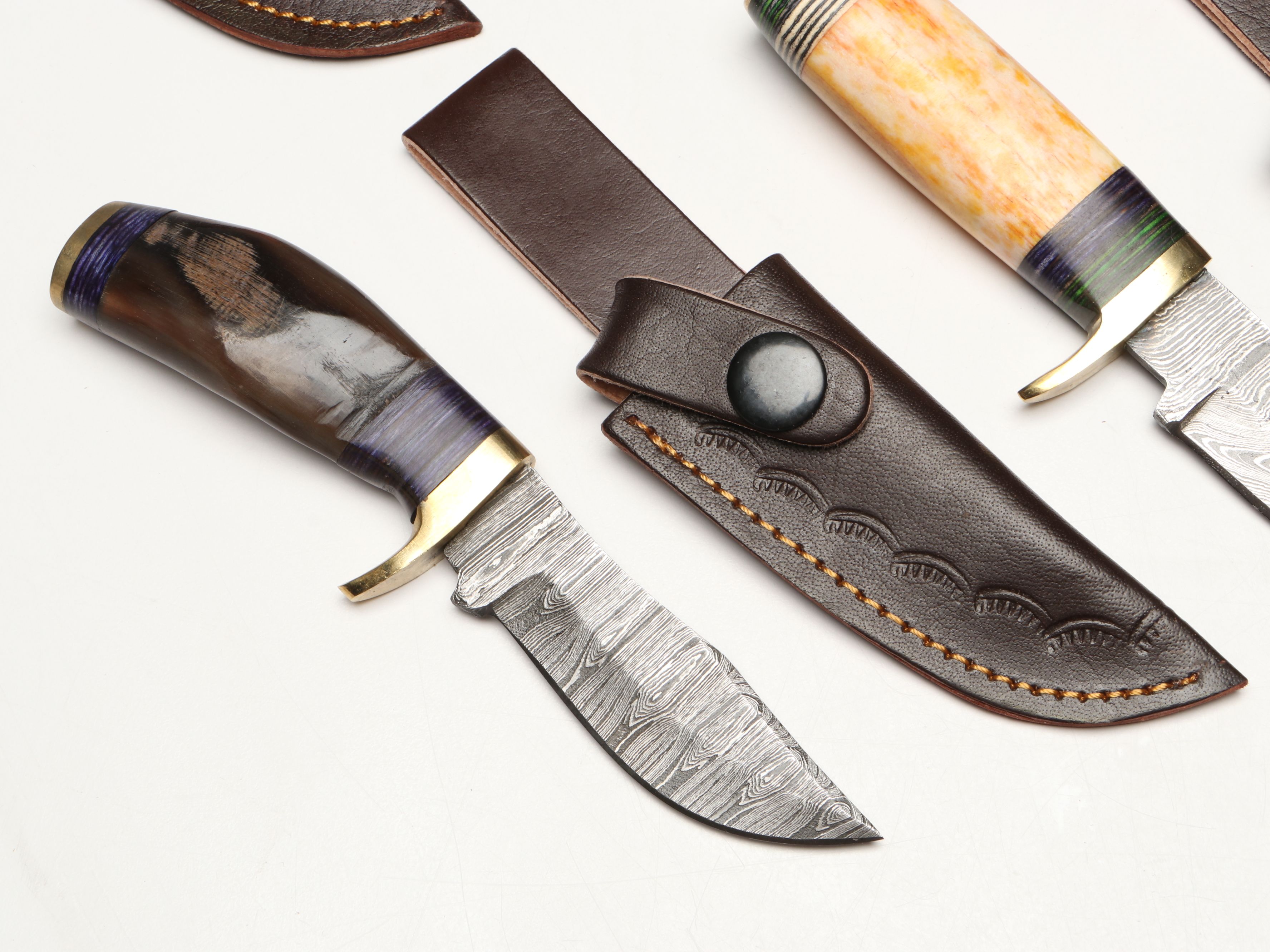Damascus Steel Skinner and Hunting Knives in Leather Scabbards