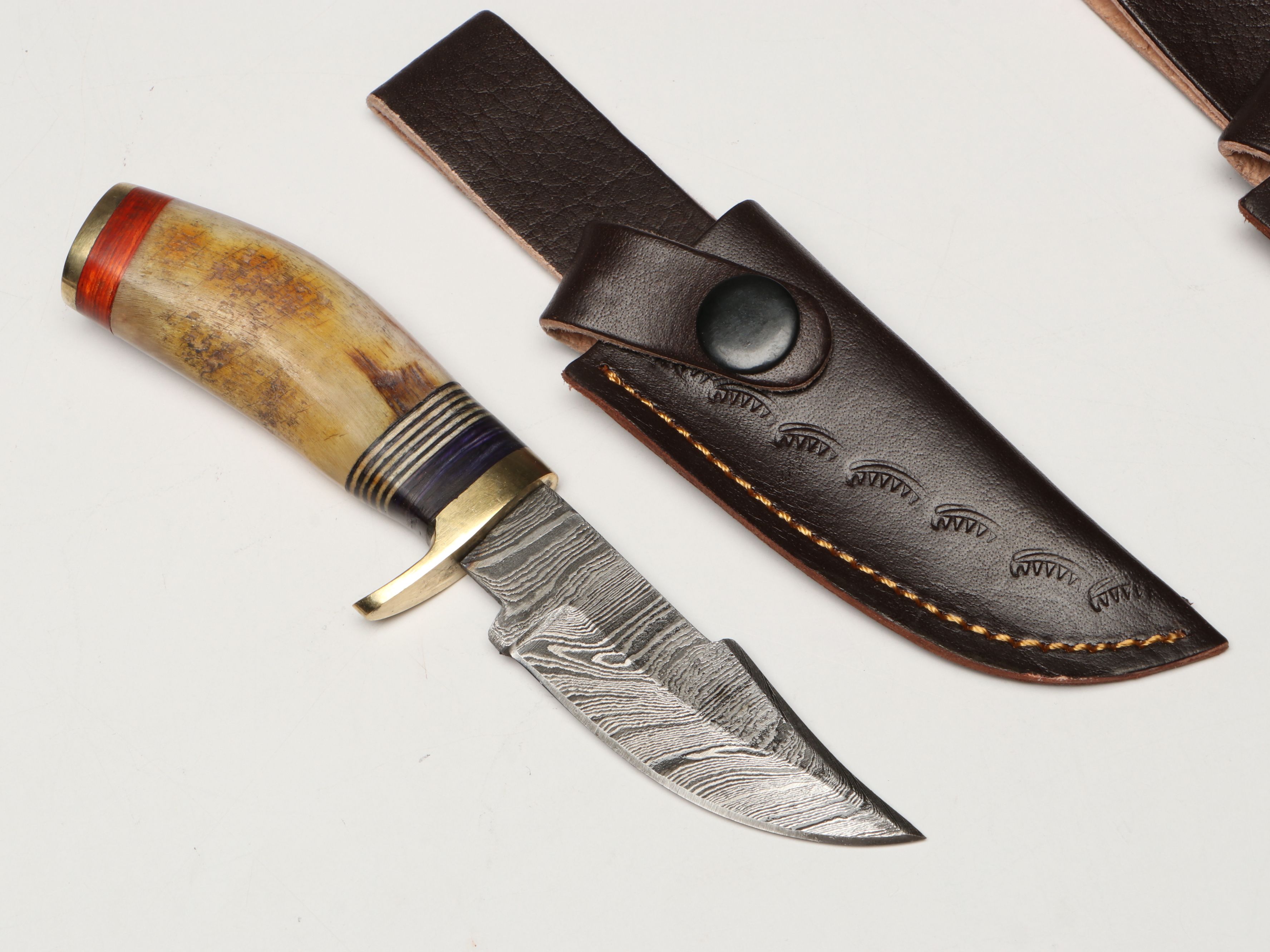 Damascus Steel Skinner and Hunting Knives in Leather Scabbards
