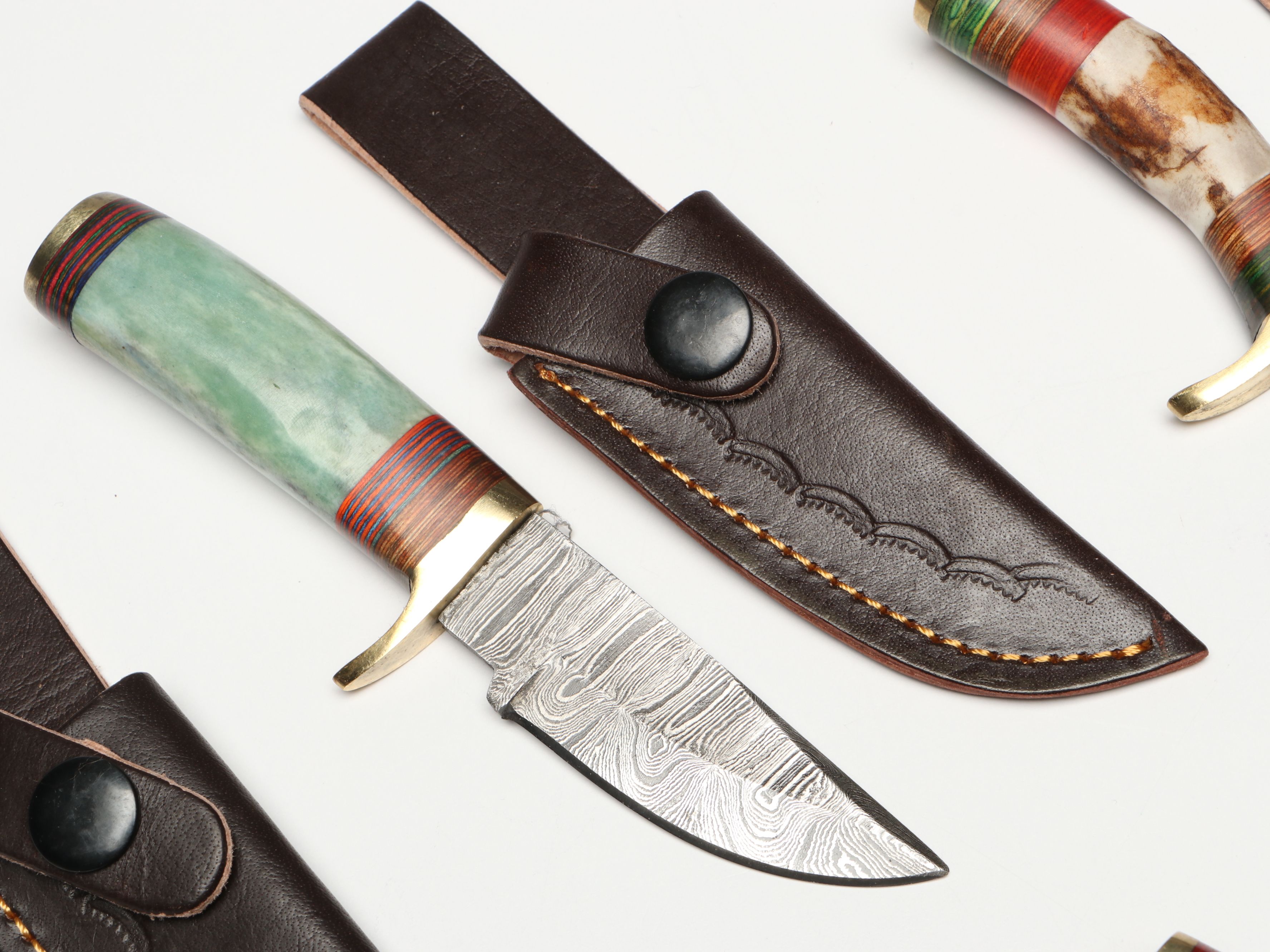 Damascus Steel Skinner and Hunting Knives in Leather Scabbards