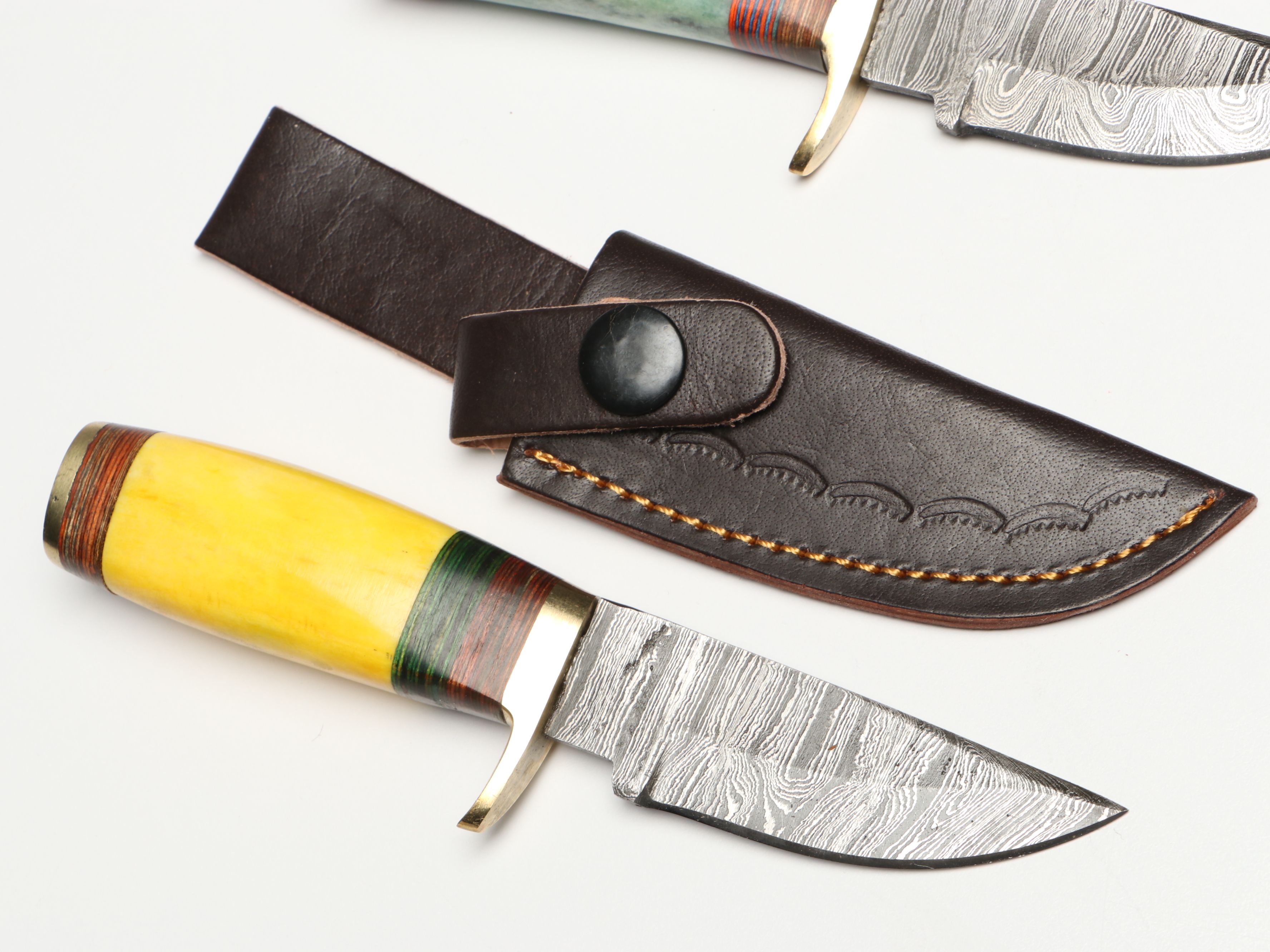 Damascus Steel Skinner and Hunting Knives in Leather Scabbards