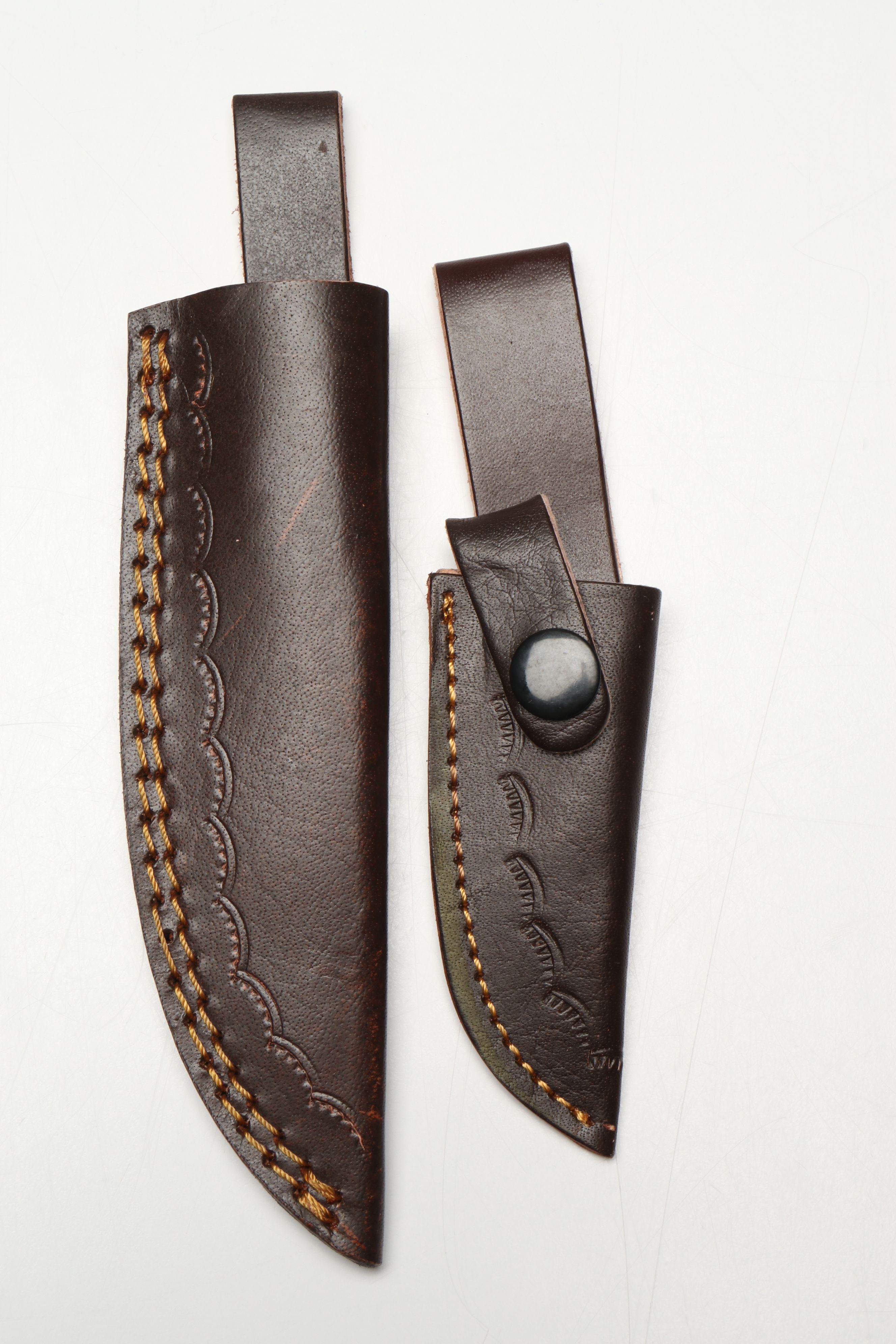 Damascus Steel Skinner and Hunting Knives in Leather Scabbards