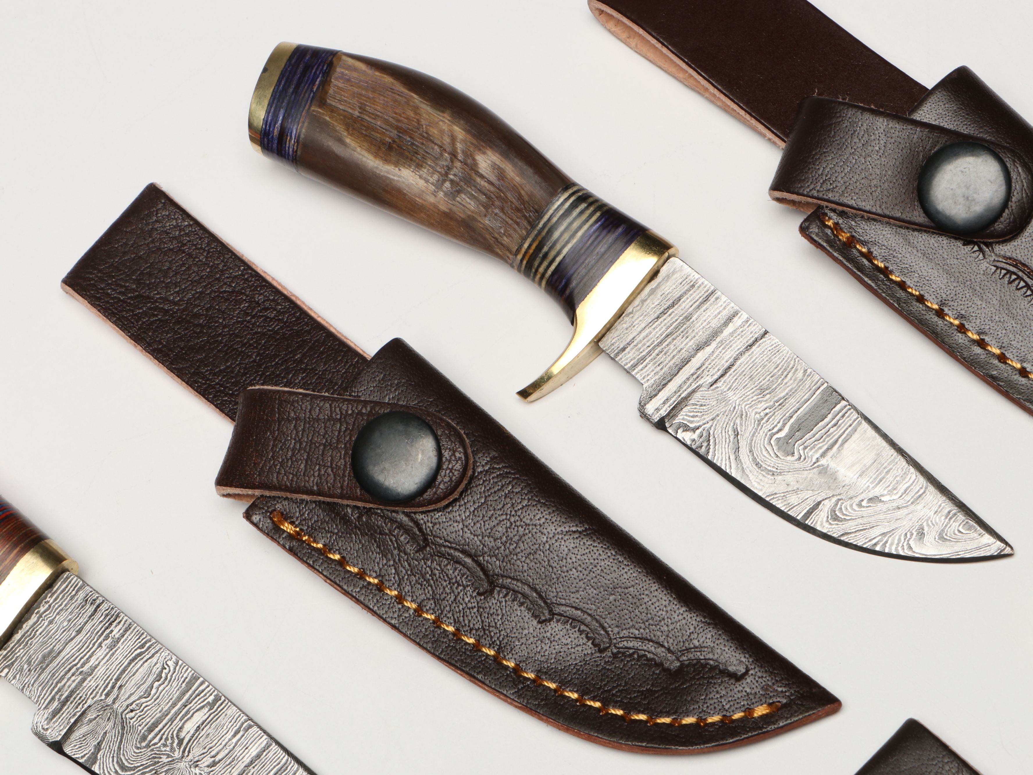 Damascus Steel Skinner and Hunting Knives in Leather Scabbards