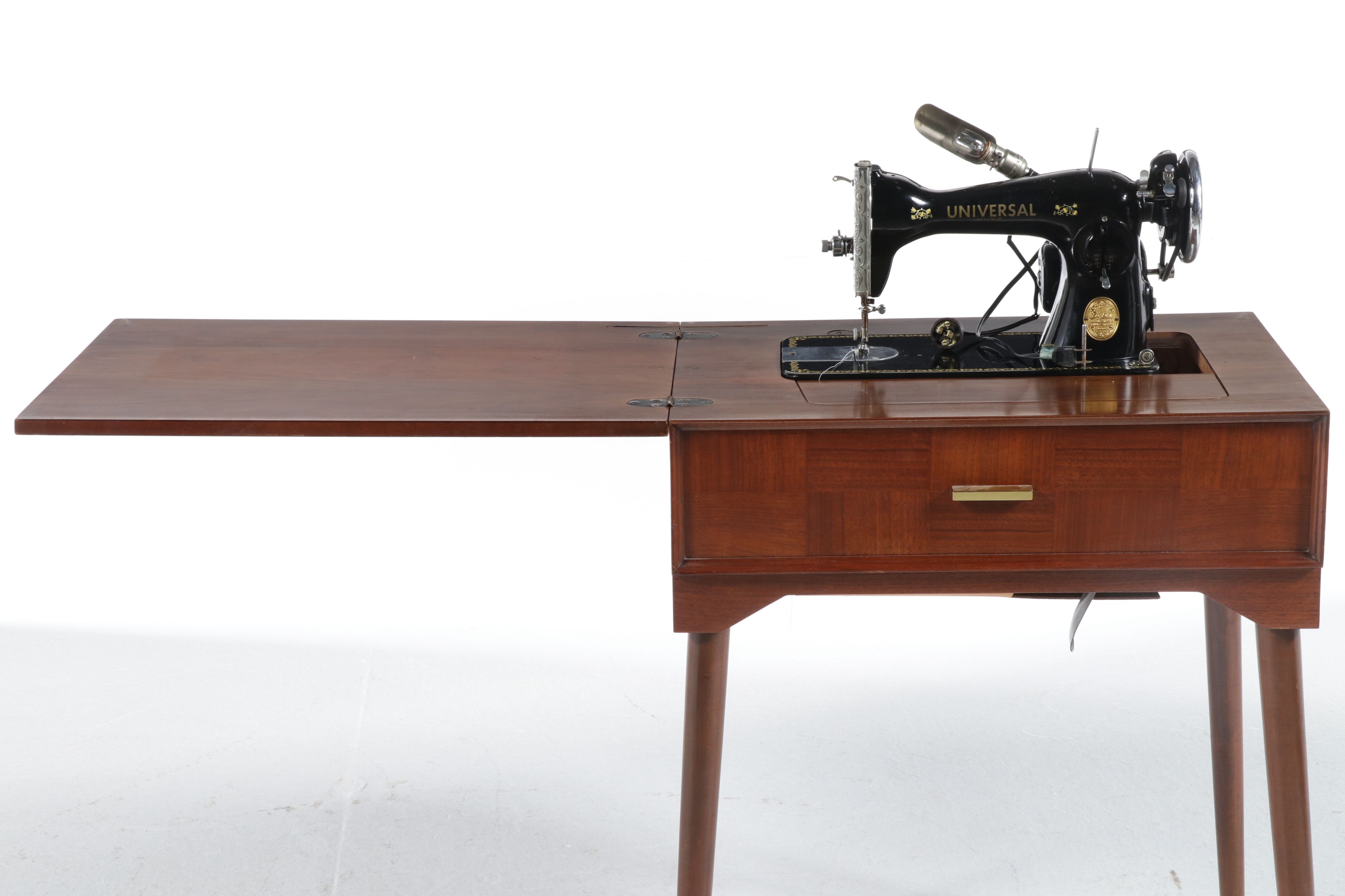 Vintage Universal "Deluxe" Sewing Machine in Table