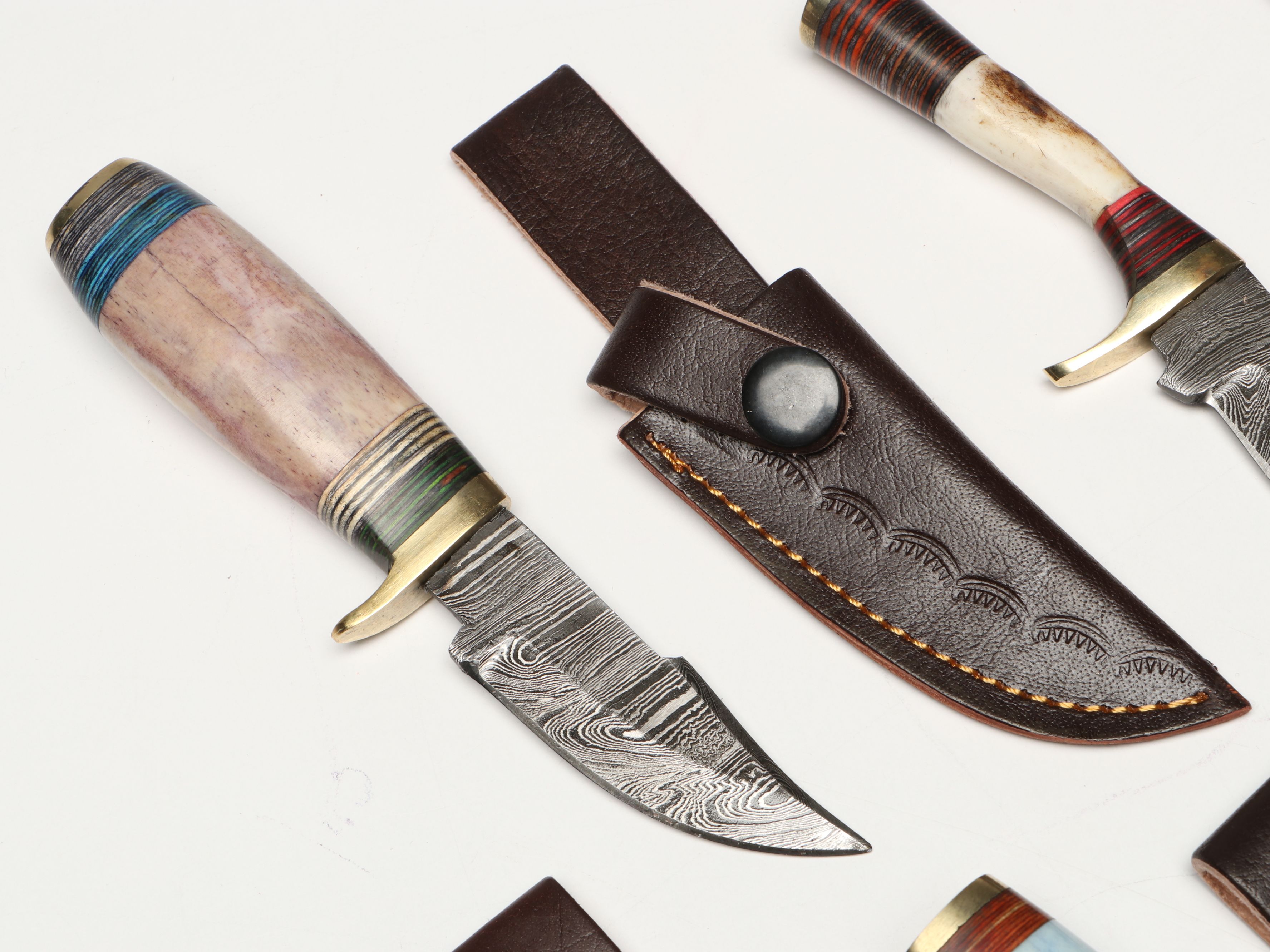 Damascus Steel Skinner and Hunting Knives in Leather Scabbards