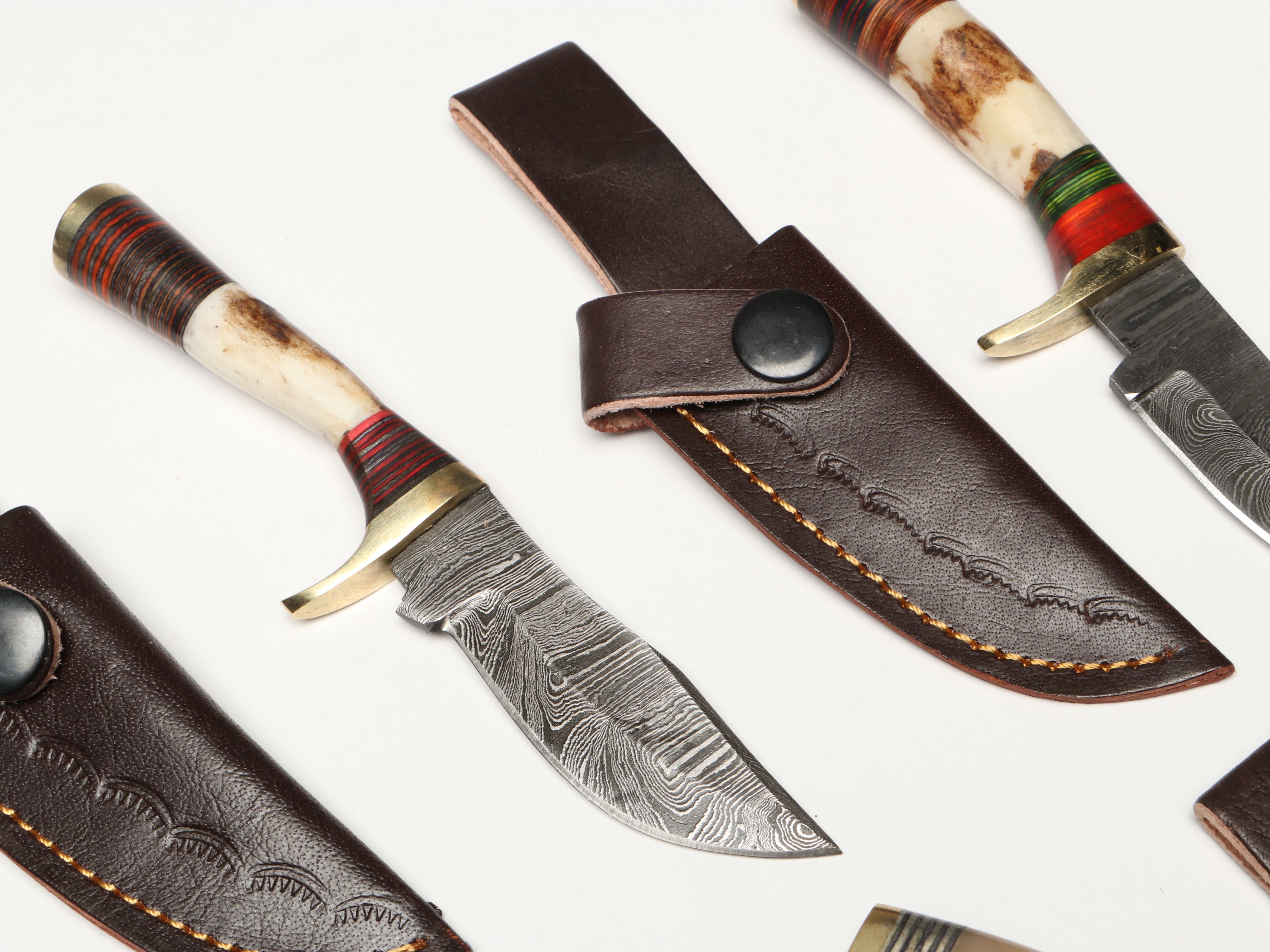 Damascus Steel Skinner and Hunting Knives in Leather Scabbards