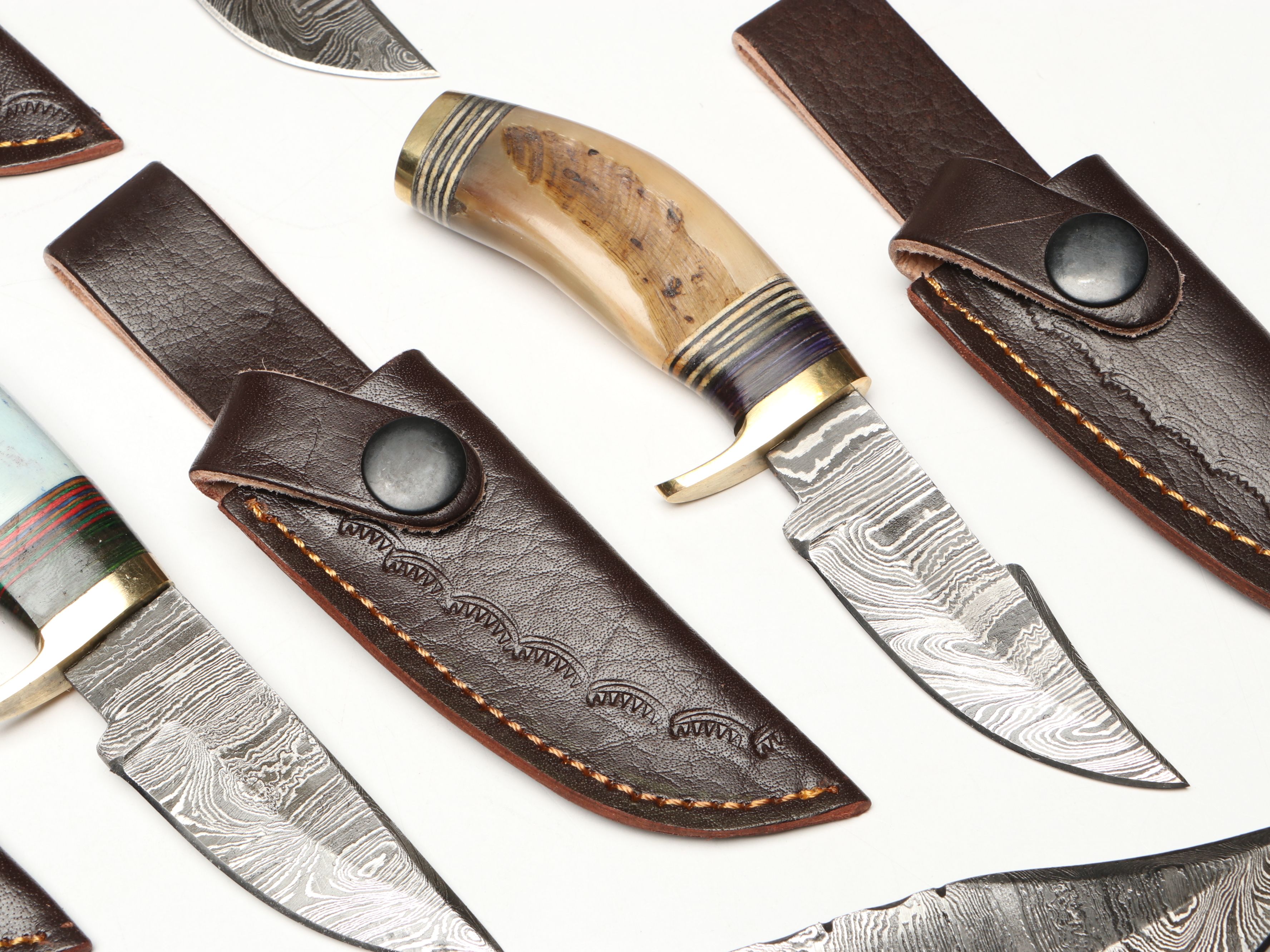 Damascus Steel Skinner and Hunting Knives in Leather Scabbards