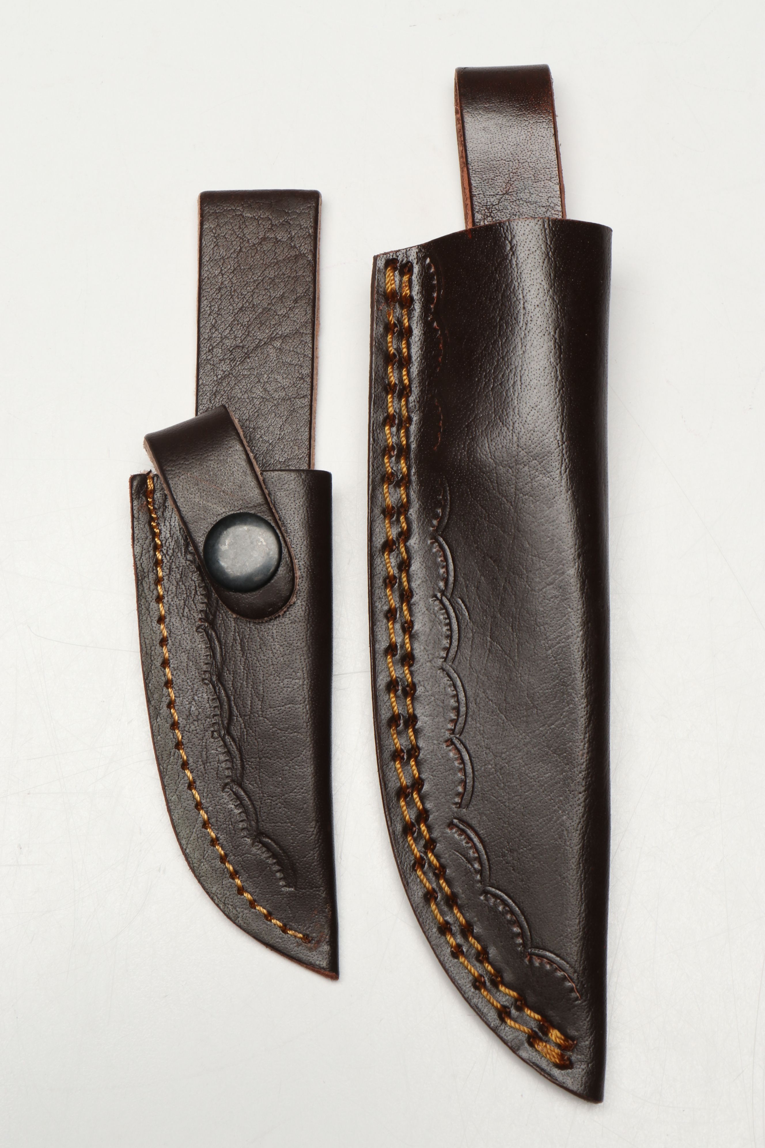 Damascus Steel Skinner and Hunting Knives in Leather Scabbards