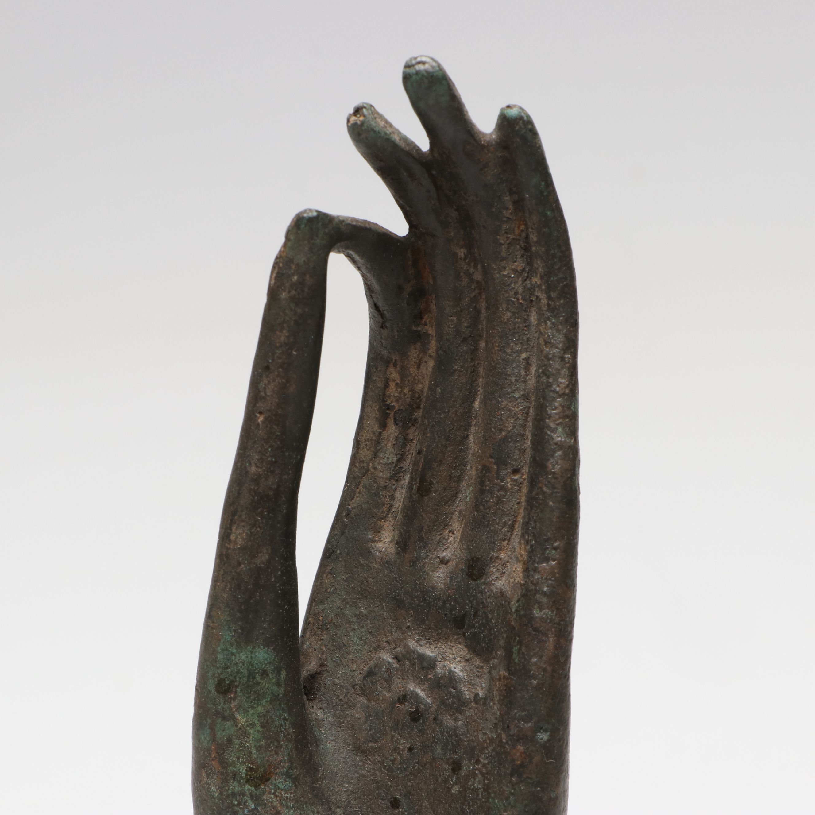 Thai Style Patinated Cast Metal Buddha Hand on Wooden Base
