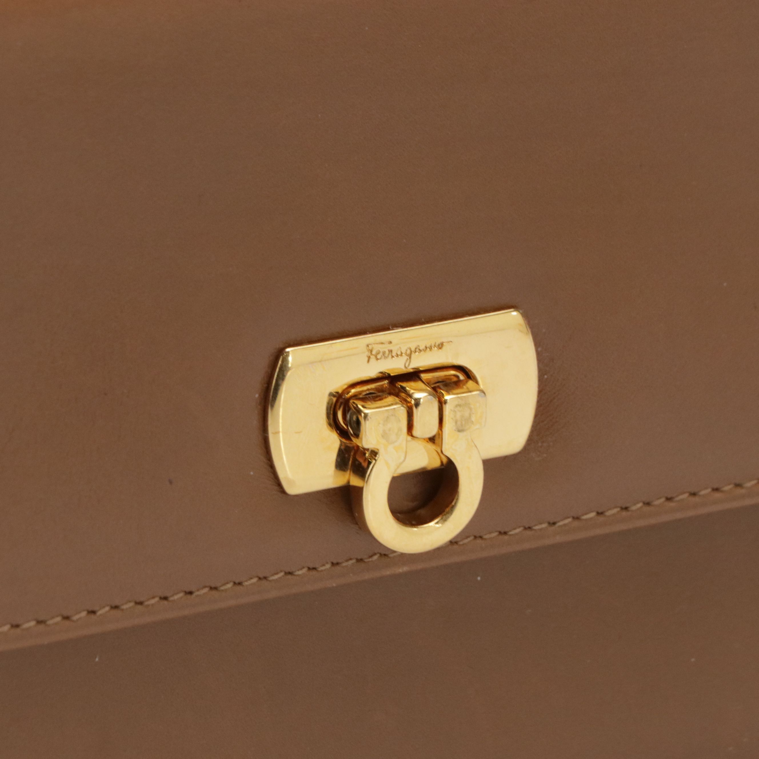 Salvatore Ferragmao Gancini Closure Trifold Wallet in Brown Leather