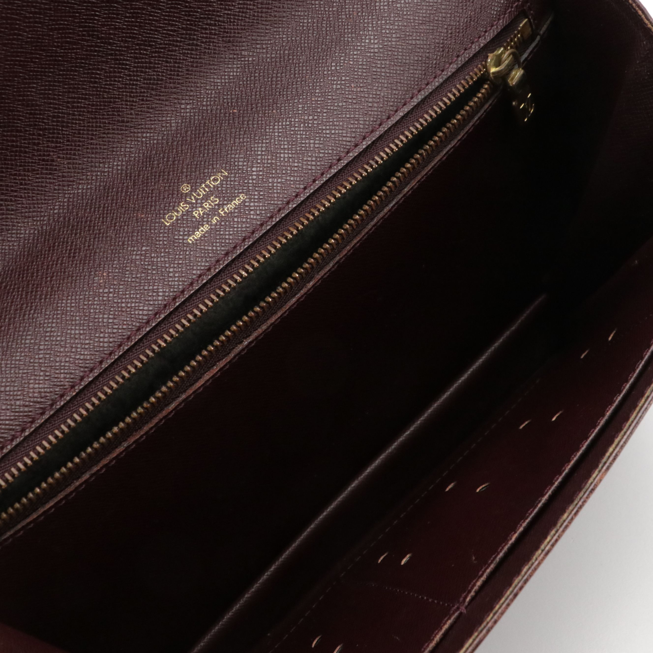 Louis Vuitton Pochette Kourad Wristlet in Taïga Leather