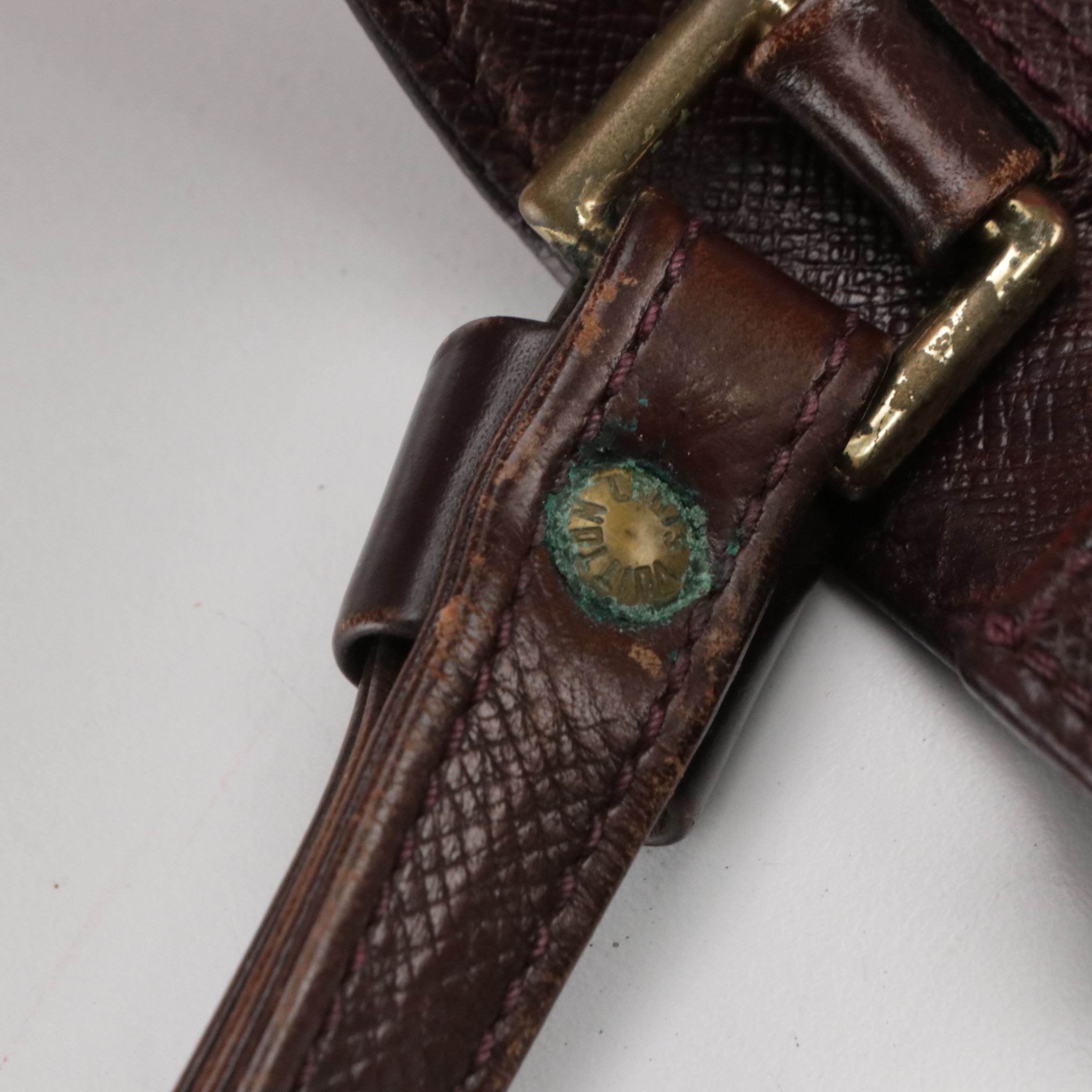 Louis Vuitton Pochette Kourad Wristlet in Taïga Leather