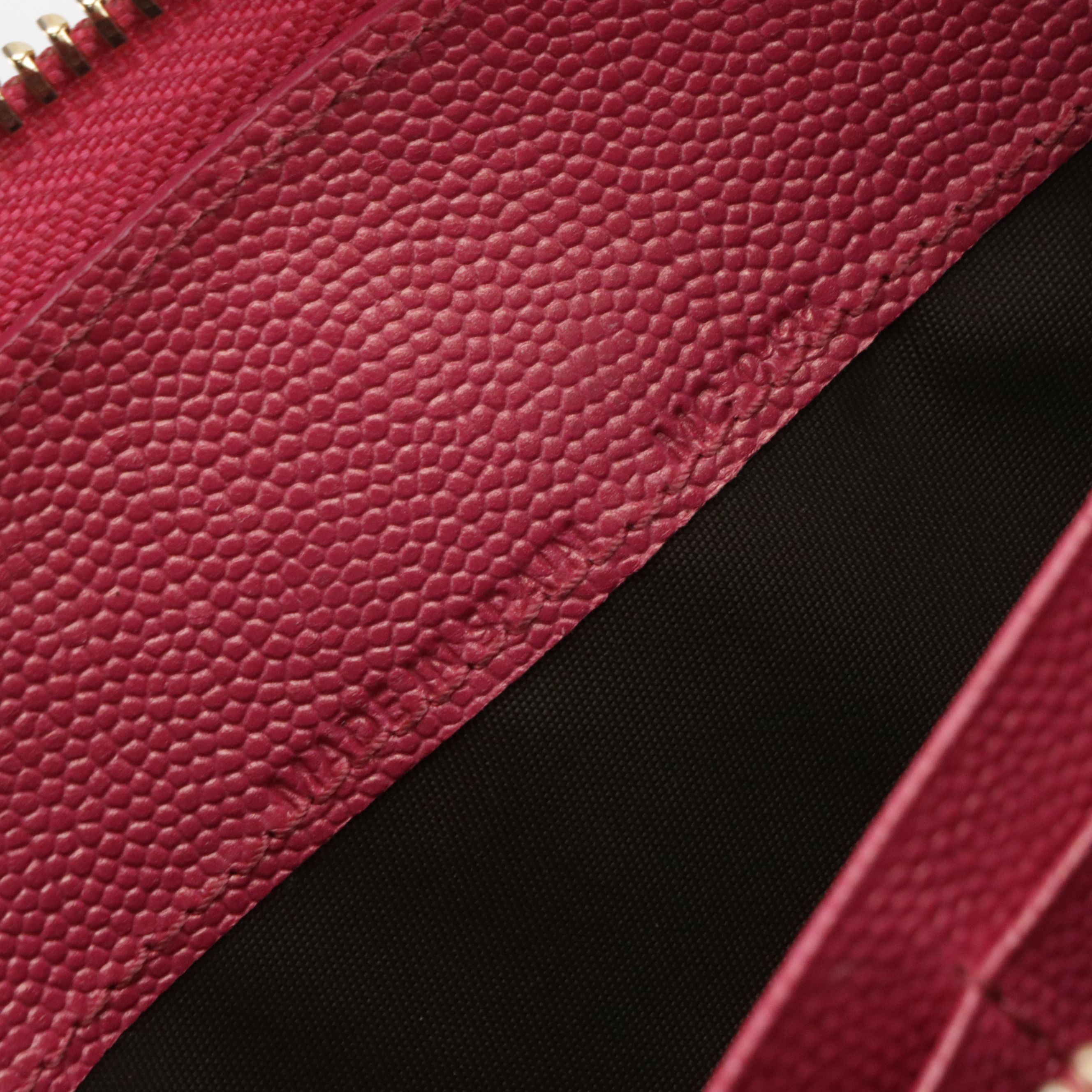 Christian Dior Zip Around Wallet in Pink Pebbled Leather