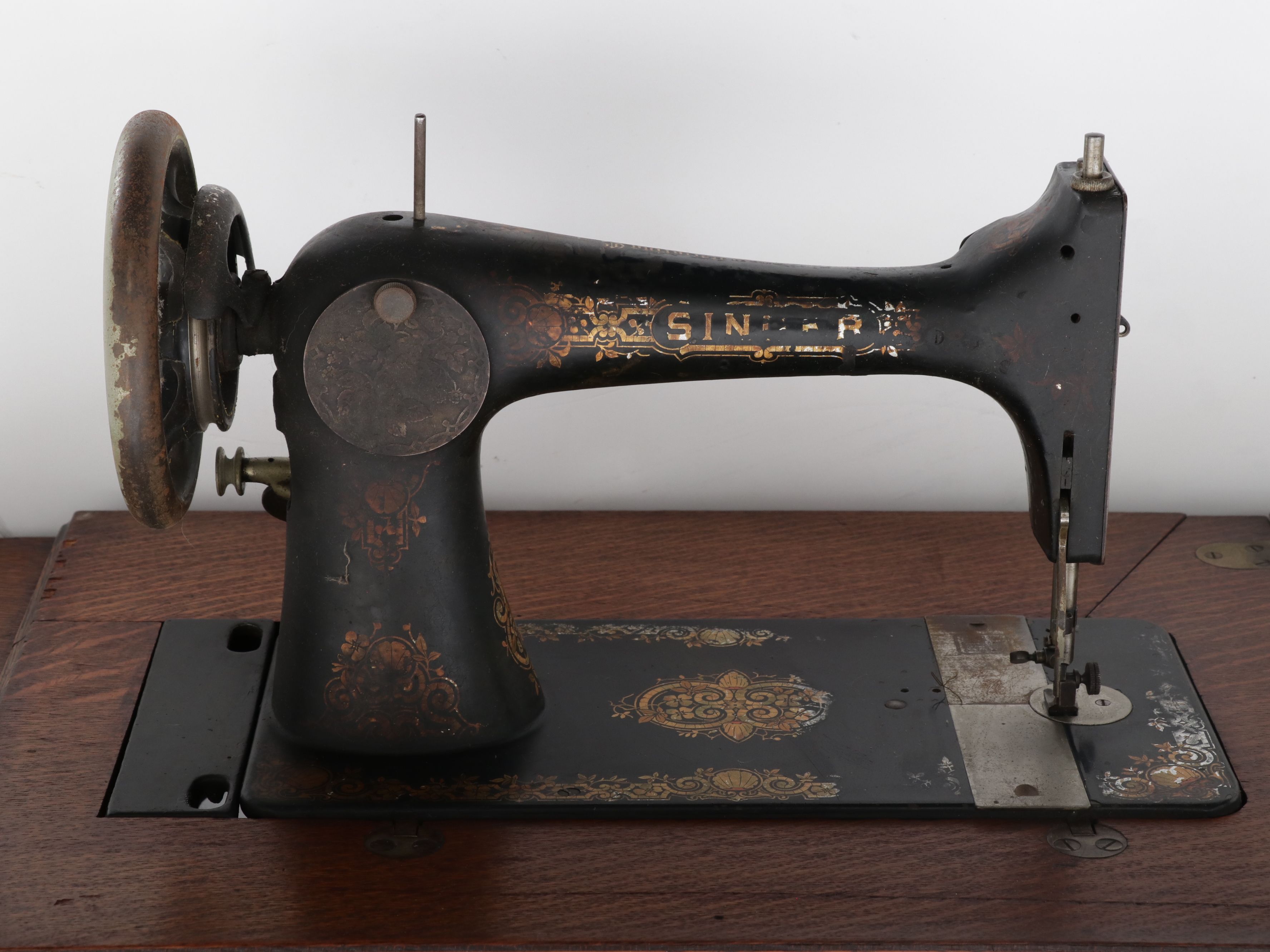 Singer Sewing Machine Model 27 with Treadle and Oak Cabinet, 1903