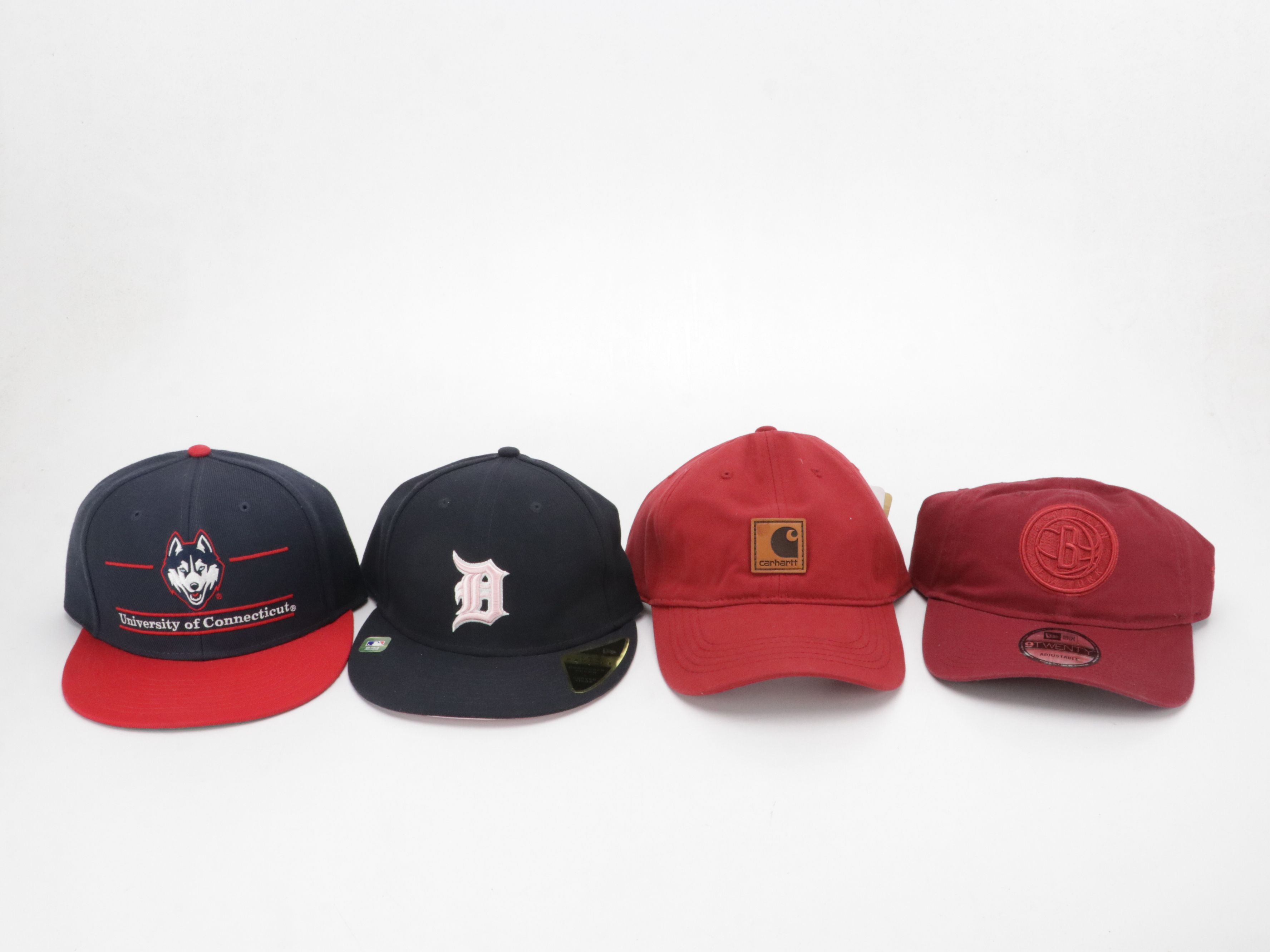 Assorted Baseball Hats Including Carhartt, UNC, MBL and More