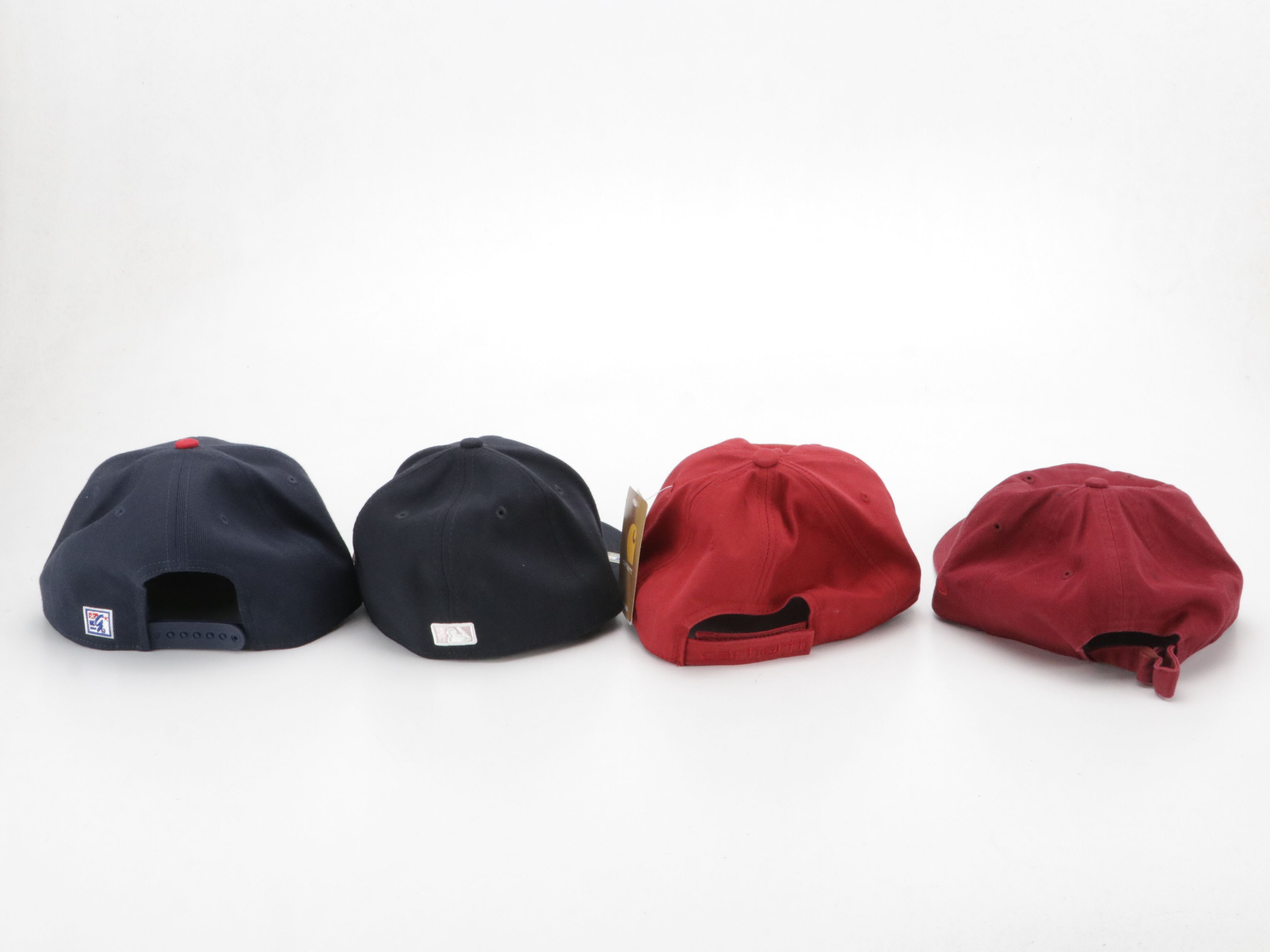 Assorted Baseball Hats Including Carhartt, UNC, MBL and More
