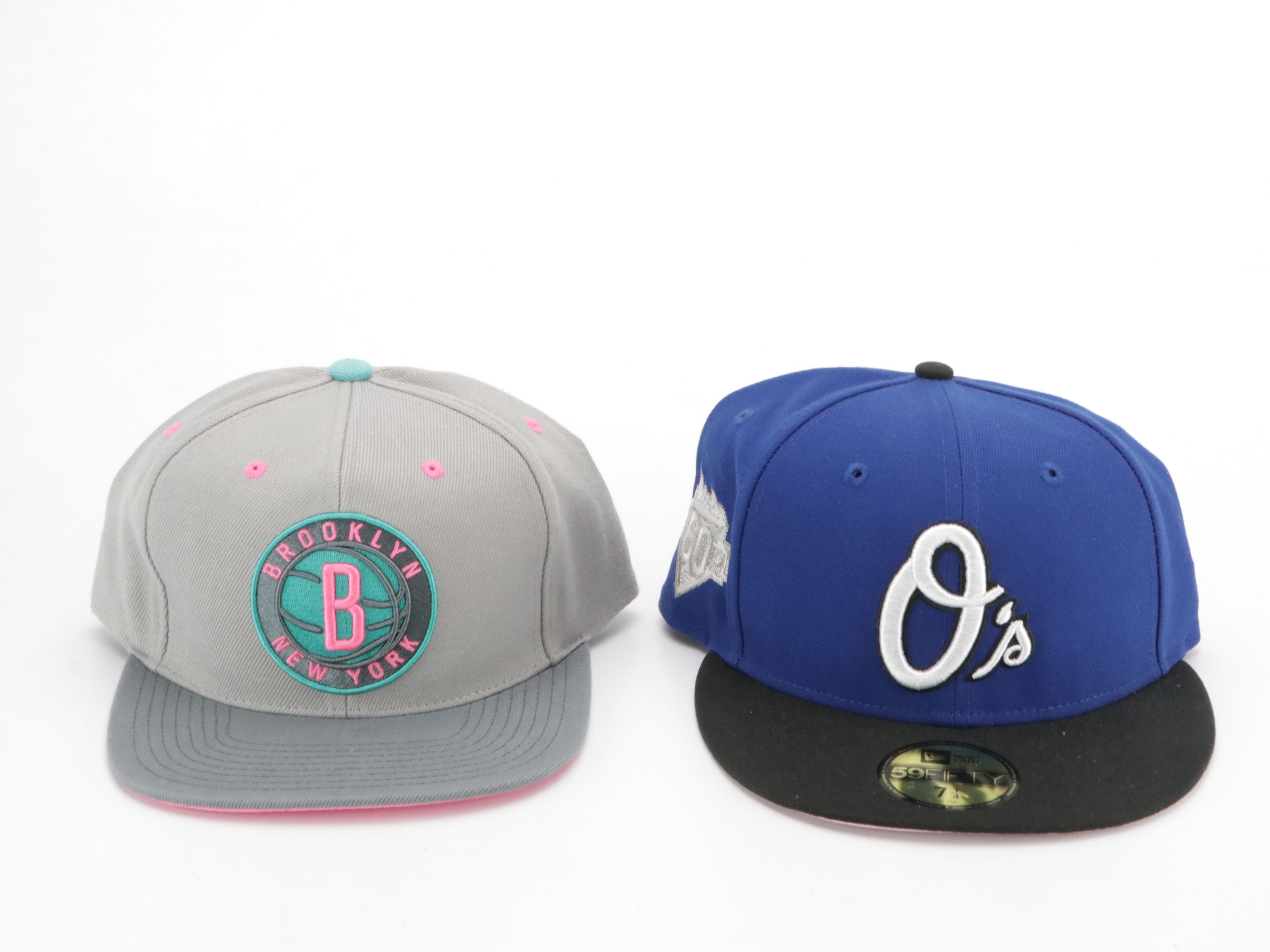 Assorted Baseball Hats Including Carhartt, UNC, MBL and More