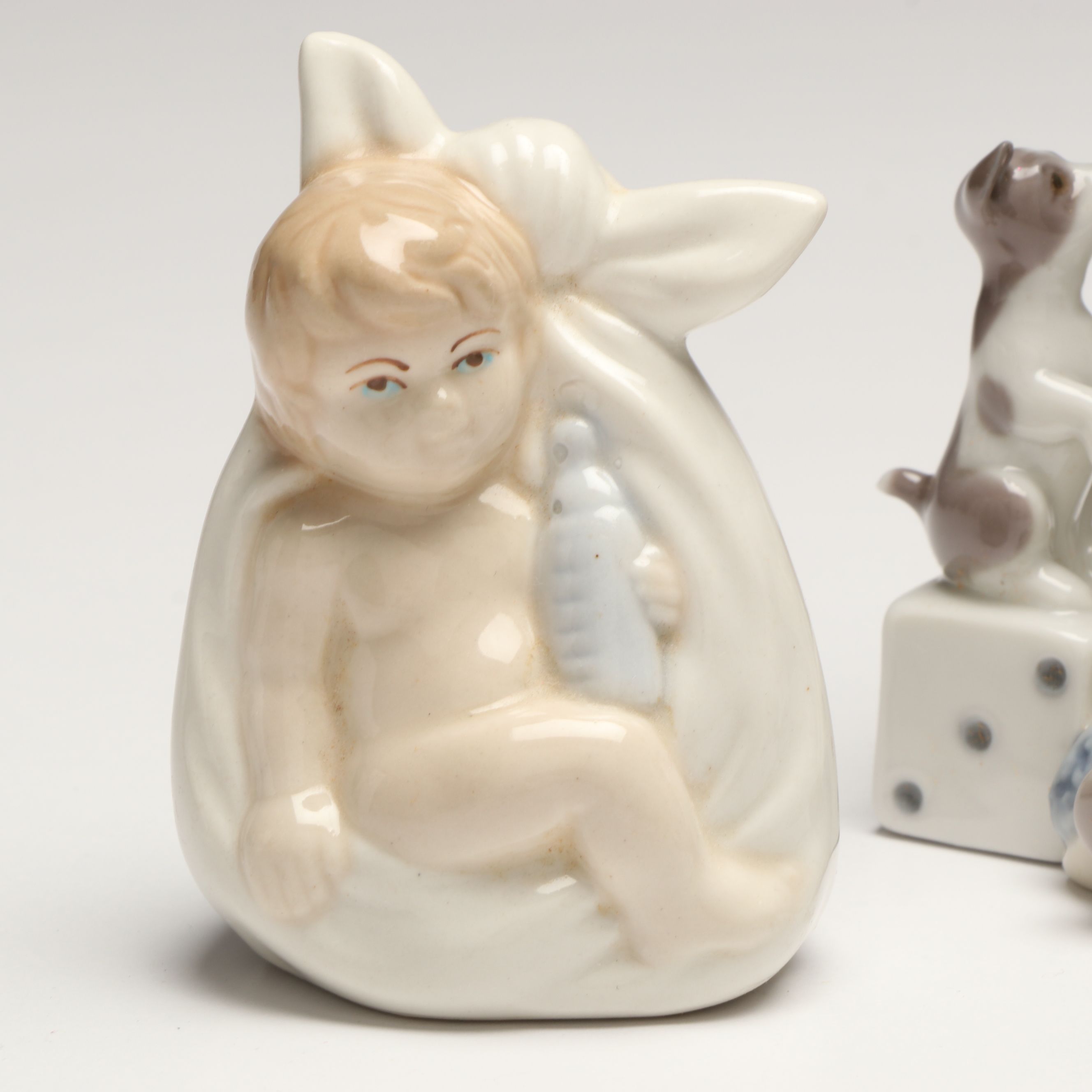 Lladró Clown with Puppy Porcelain Figures and Other Swaddled Baby Figure