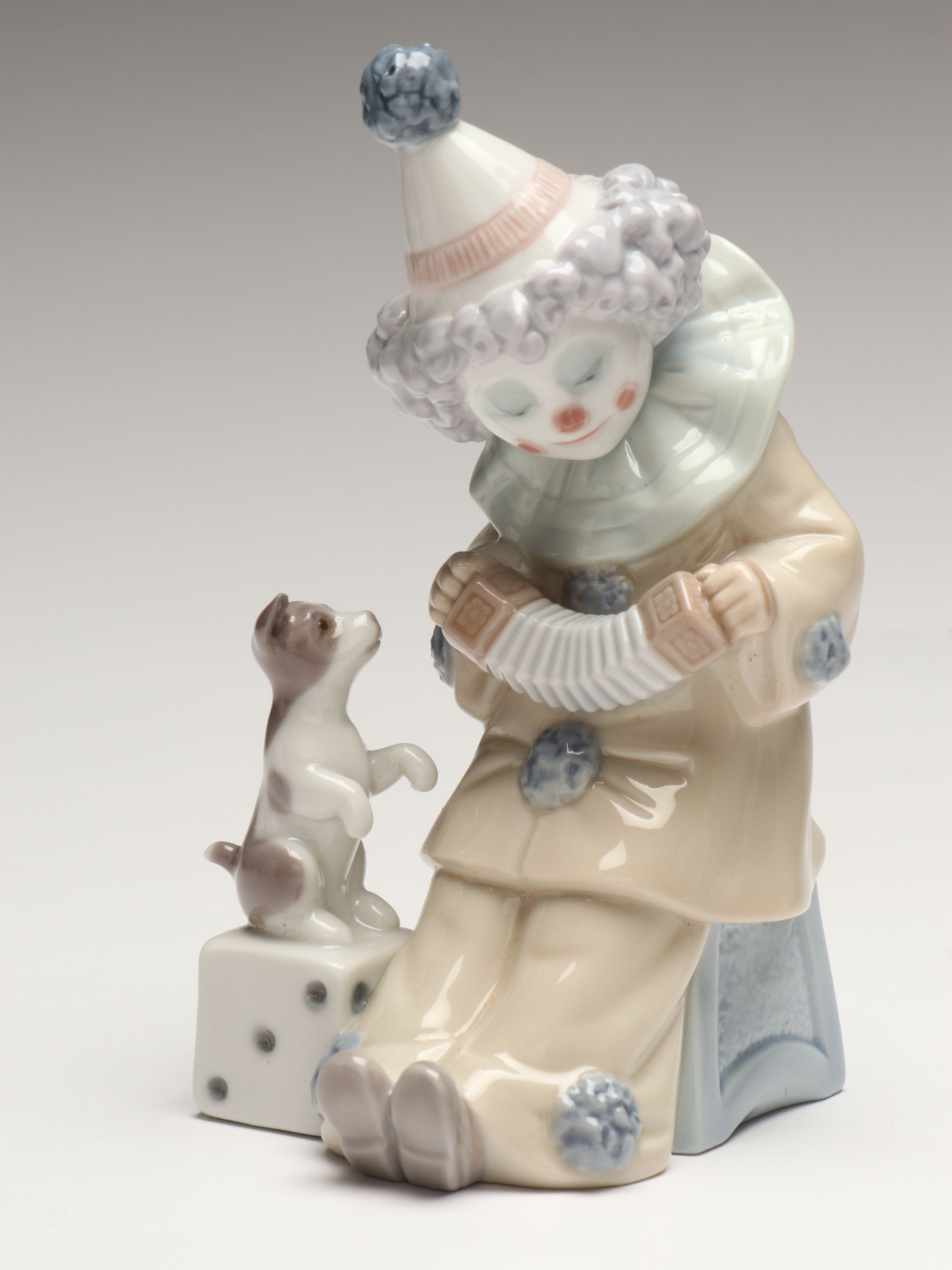 Lladró Clown with Puppy Porcelain Figures and Other Swaddled Baby Figure