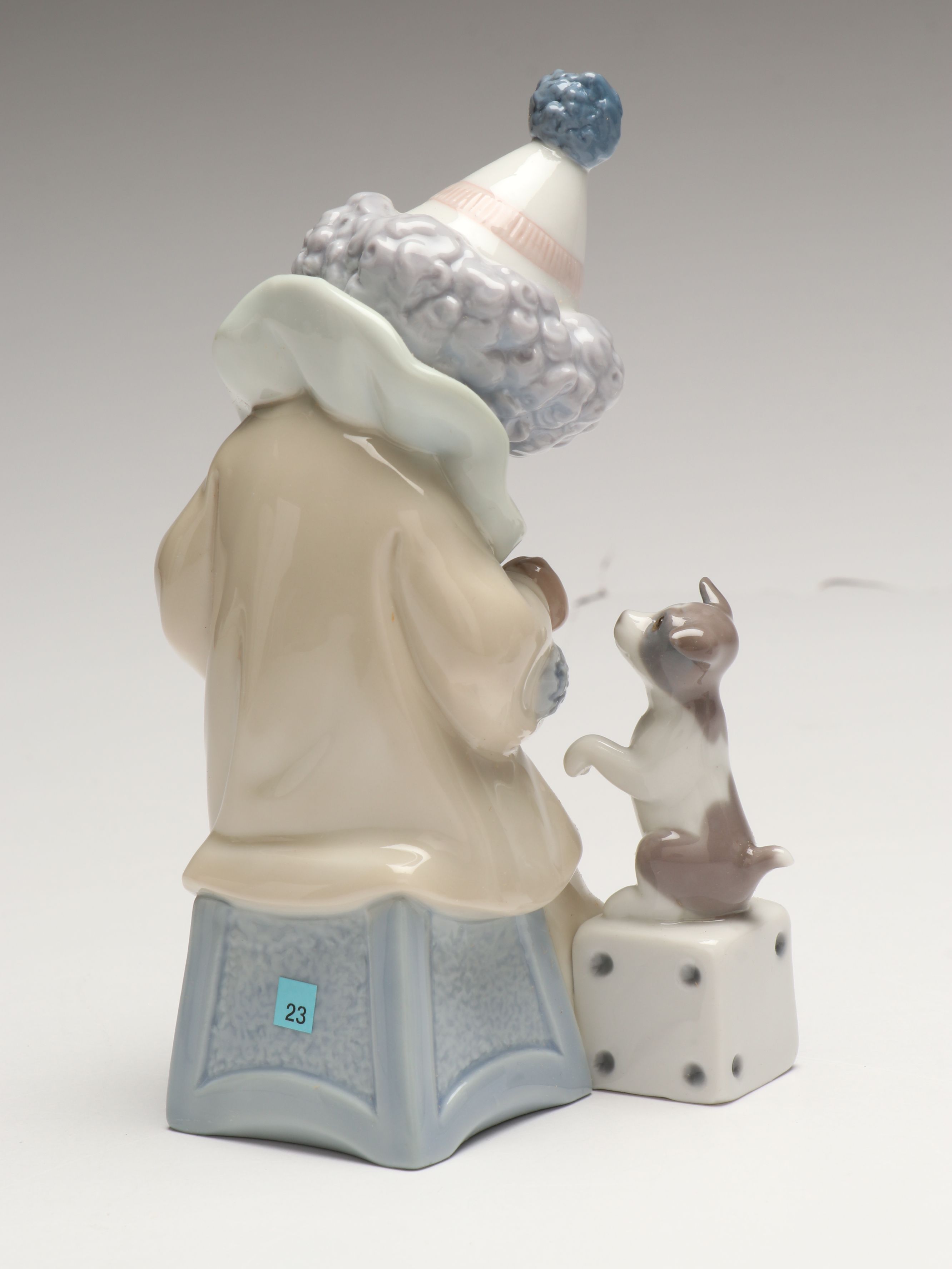 Lladró Clown with Puppy Porcelain Figures and Other Swaddled Baby Figure